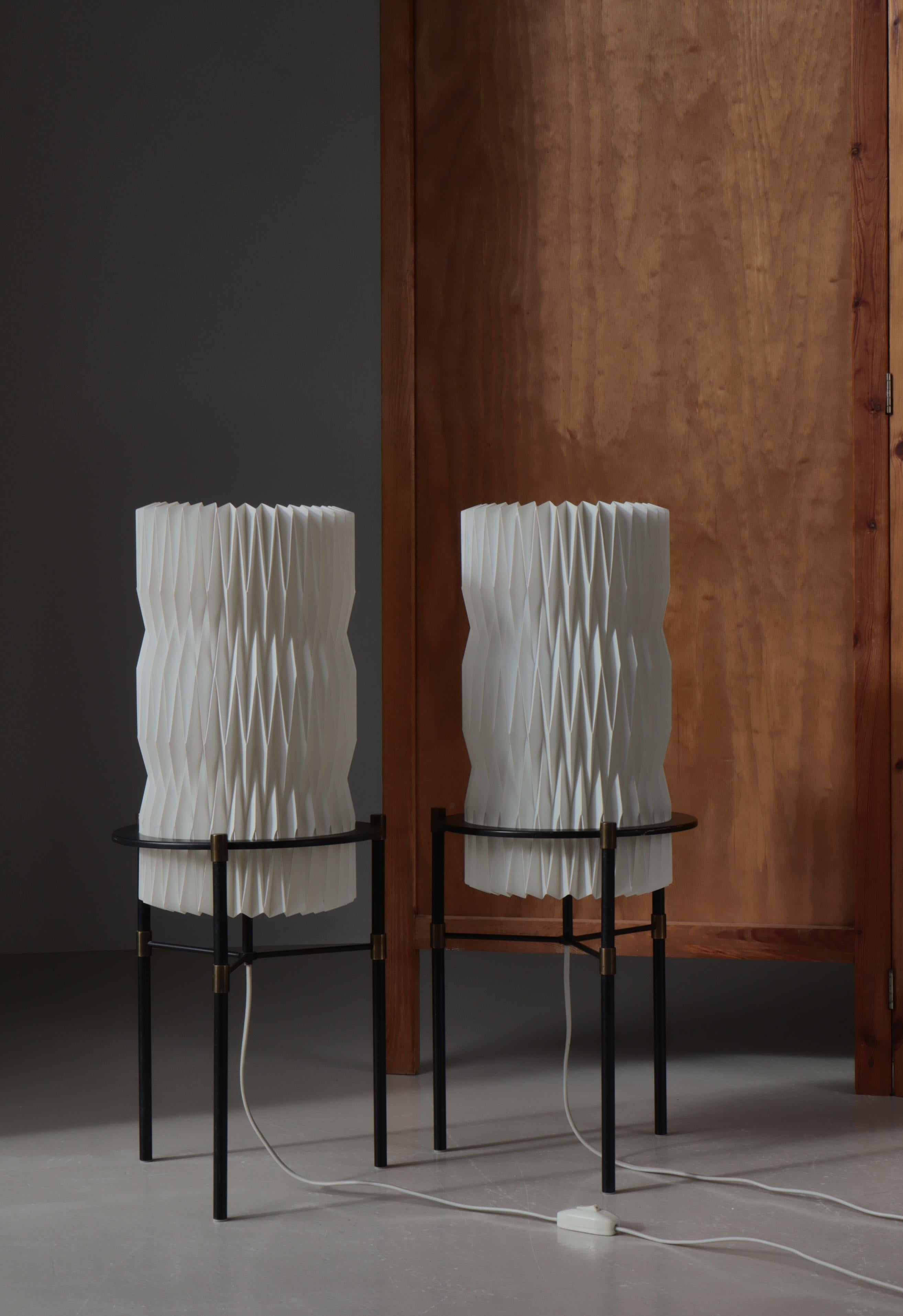 Very rare set of 1960s floor lamps designed by Tove & Edvard Kindt-Larsen for manufacturer Le Klint in the 1960s, Denmark. The lamp bases are made from black lacquered iron and brass while the shade is hand folded acrylic.

Tove and Edvard