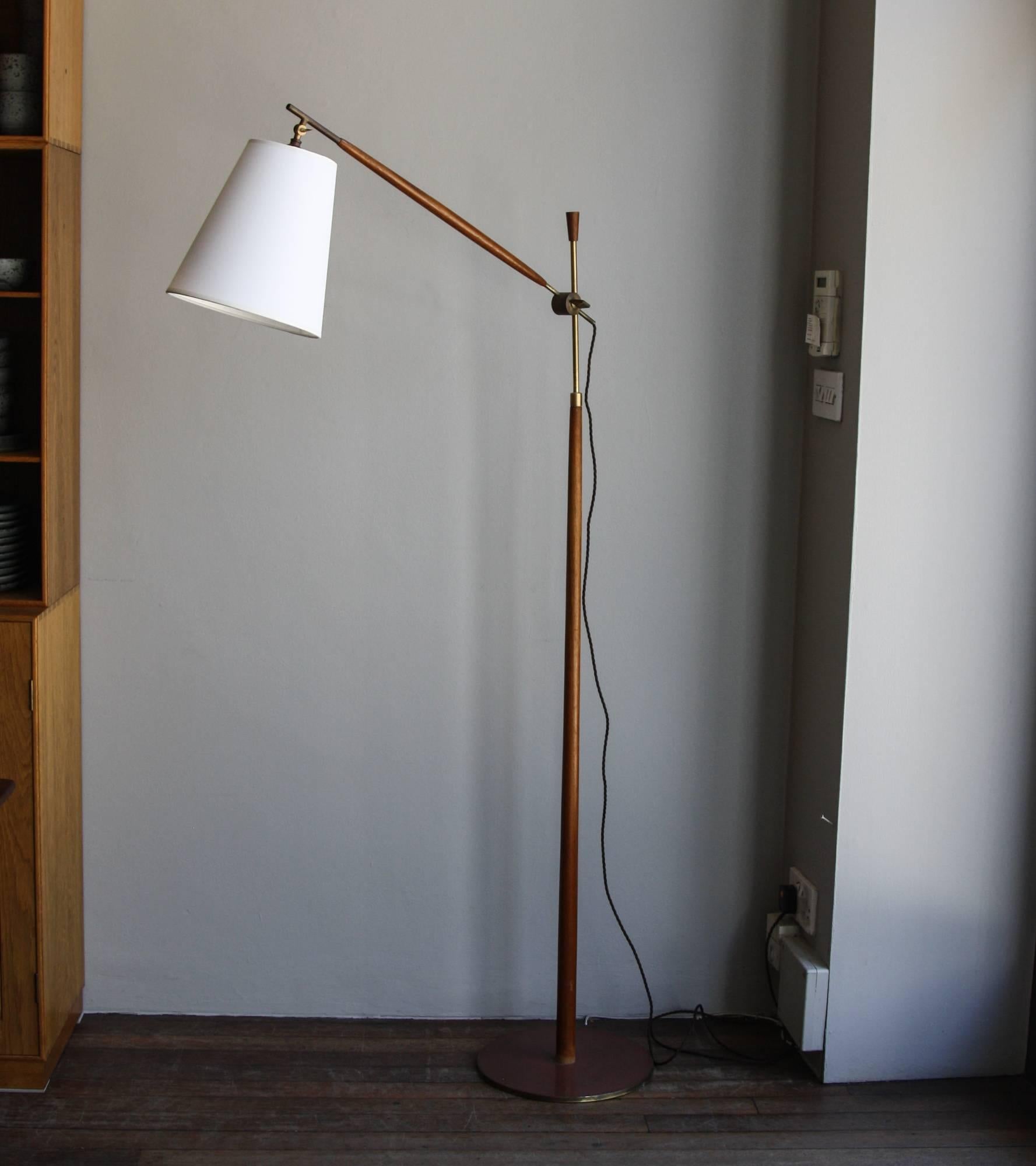 Vintage Danish floor lamp made by Le Klint in 1950s.
The head can be moved around a 360 degree solid angle while the arm can be adjusted to change is angle to the stem. Stem and arm are in polished brass covered in teak.
In excellent condition.