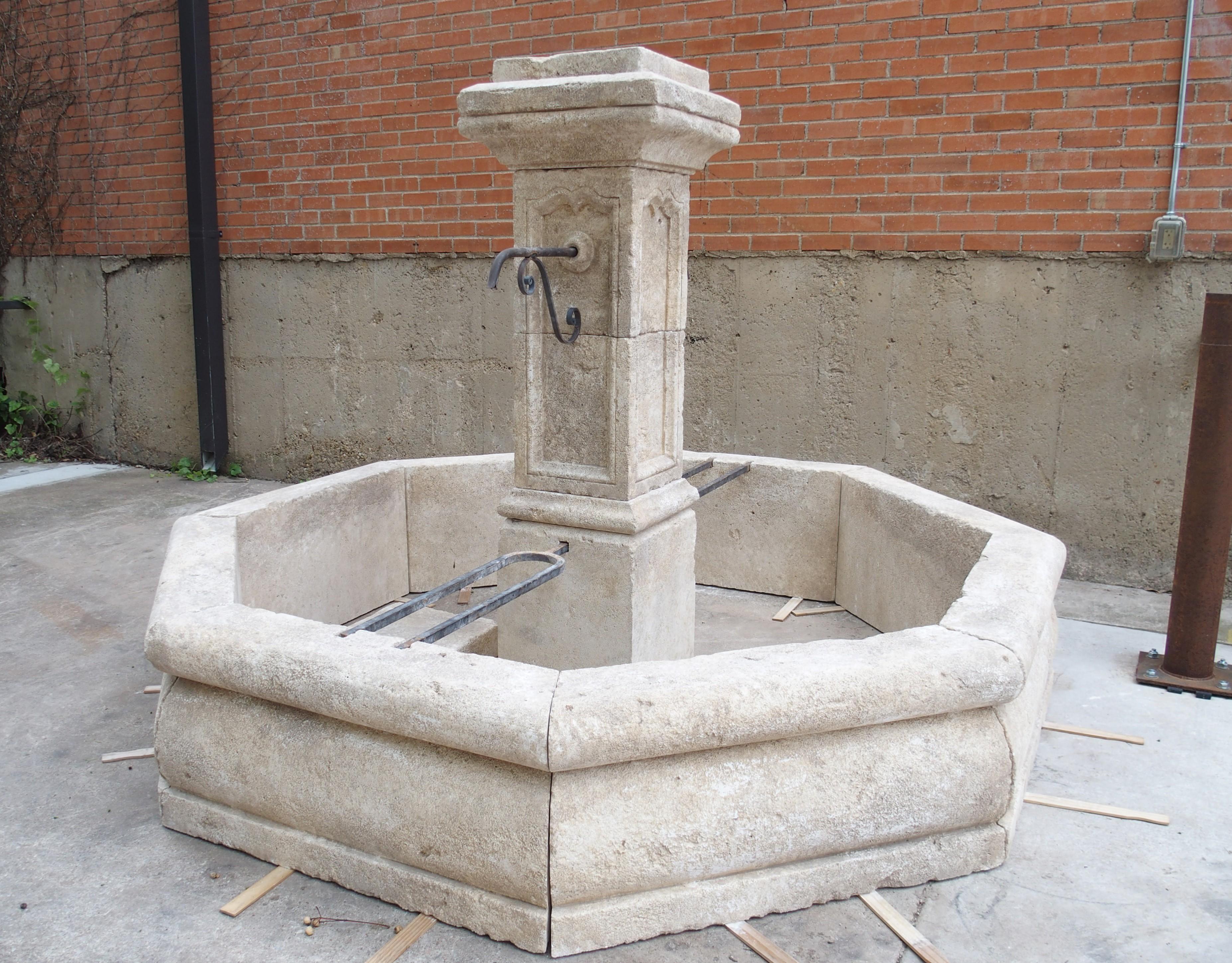 Up until the late 19th century, French villages would have had a fountain similar to this large octagonal one connected to a natural water source. Before the advent of plumbing, citizens of the village would have placed containers on the iron bars