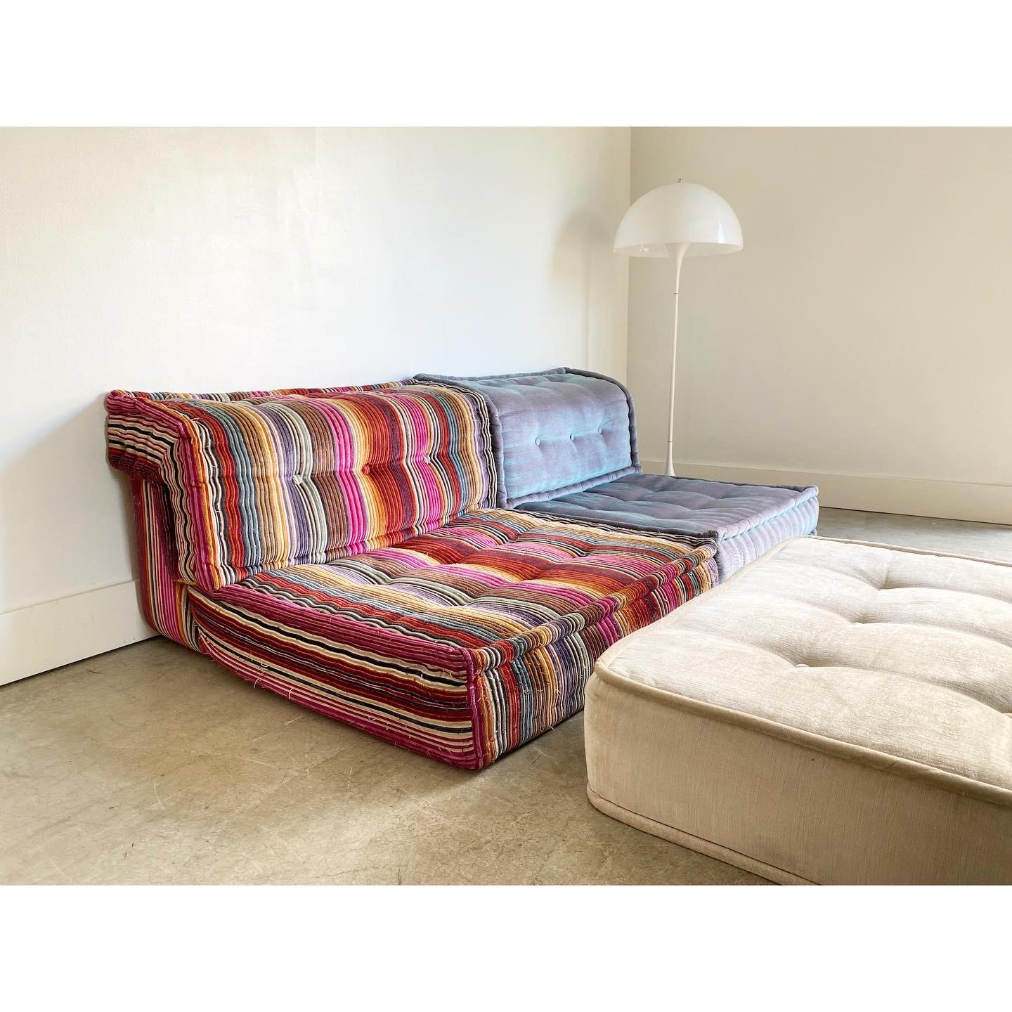 Mah-Jong modular sofa set by Hans Hopfer, designed in 1971 for Roche Bobois and in a current customized mix of textiles from the house of Missoni as well as John Paul Gaultier. Features two cushions and one custom upholstered cream colored piece