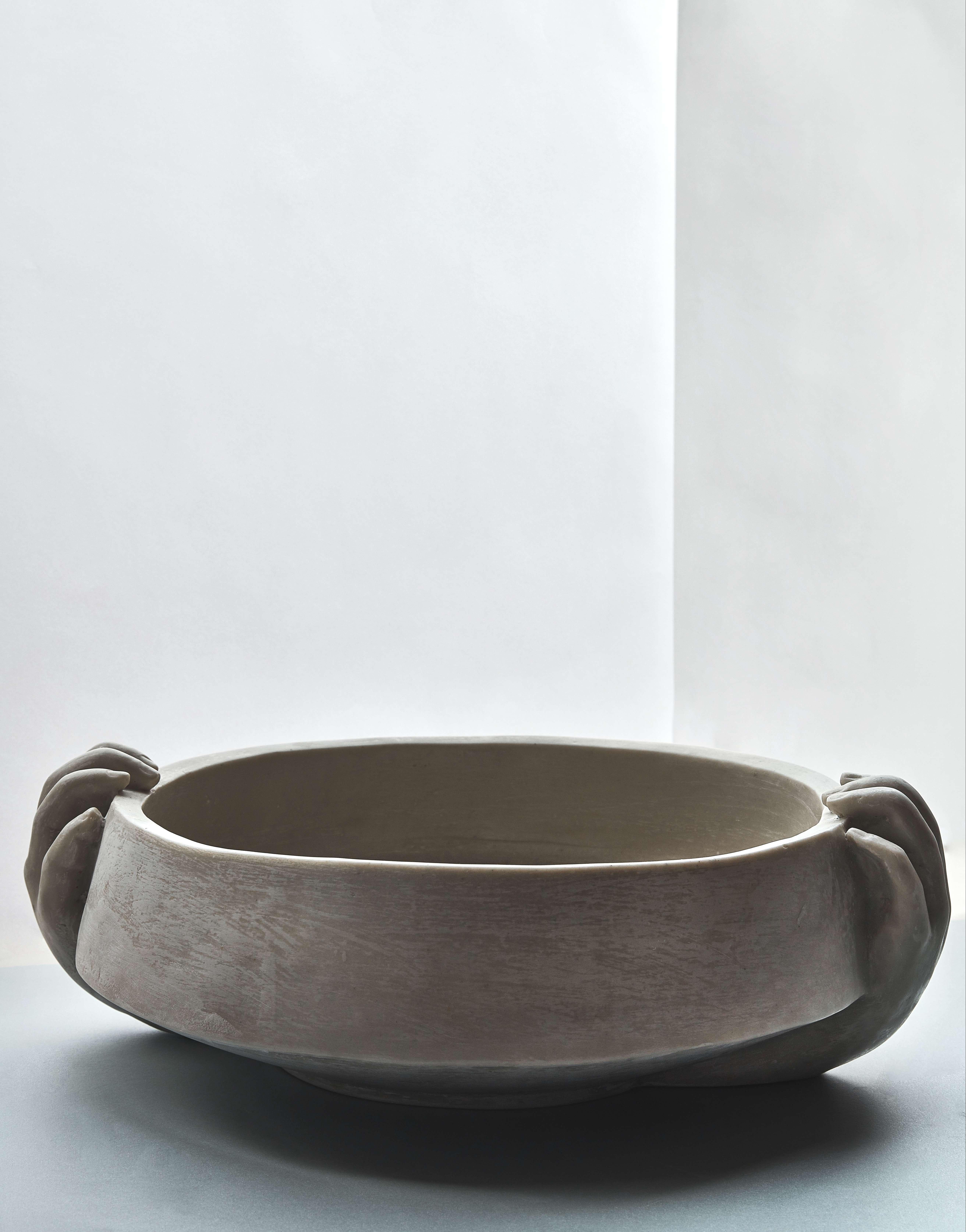 Hand-sculpted in clay and later hand cast in a mixture of resin and stone by master artisans in Colombia, Le Mani Bowl can be used as a centerpiece elevating your table to a new level.

This collection is inspired by the seducing form of the human