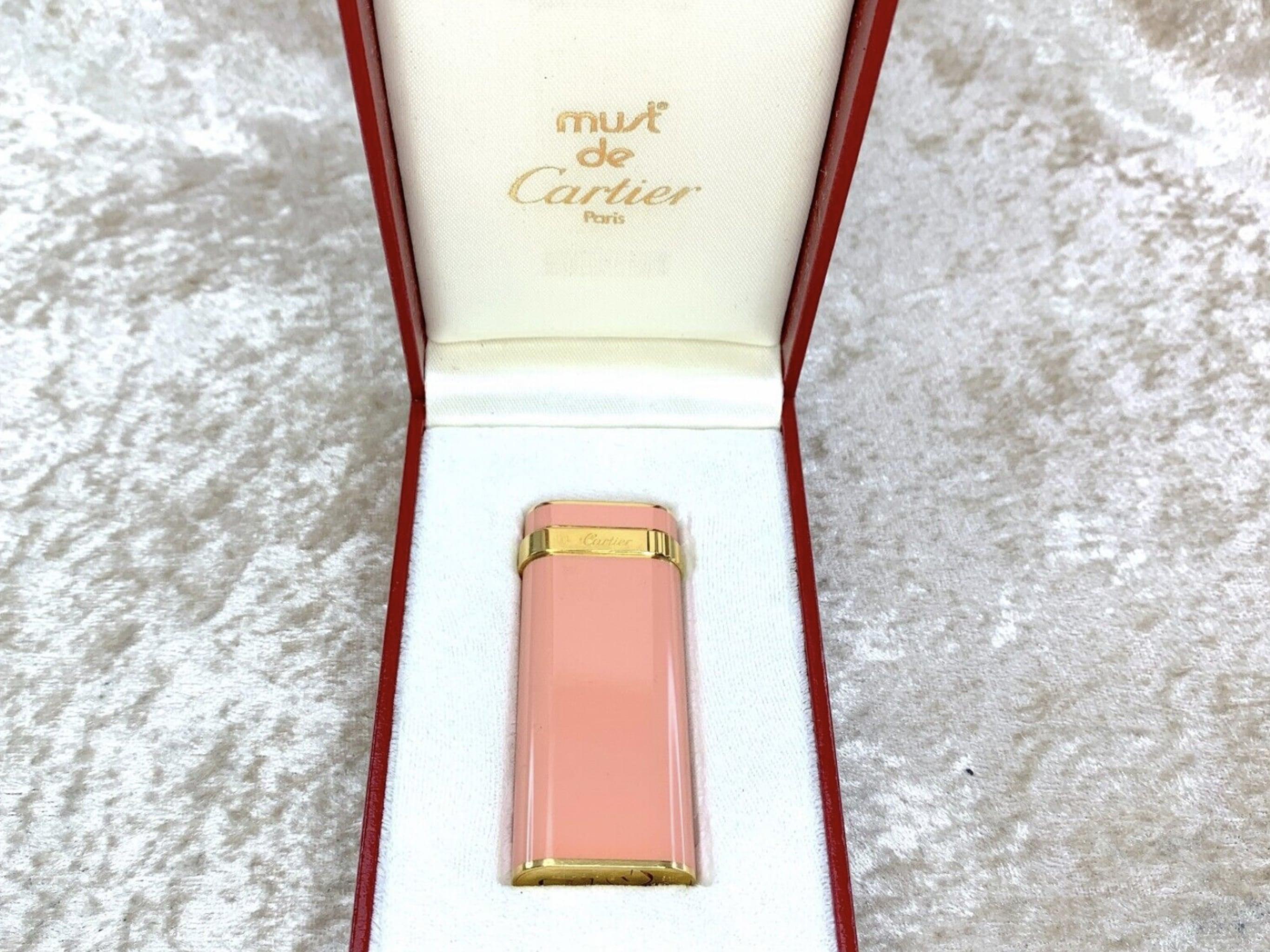 Vintage Cartier Lighter 
Short 
Oval 
Rare Pink Lacquer 
18k Gold plating 
Retro 
Circa 80s 
Paris 
In fantastic condition 
In original Cartier case 
The lighter sparks, ignites and flames 