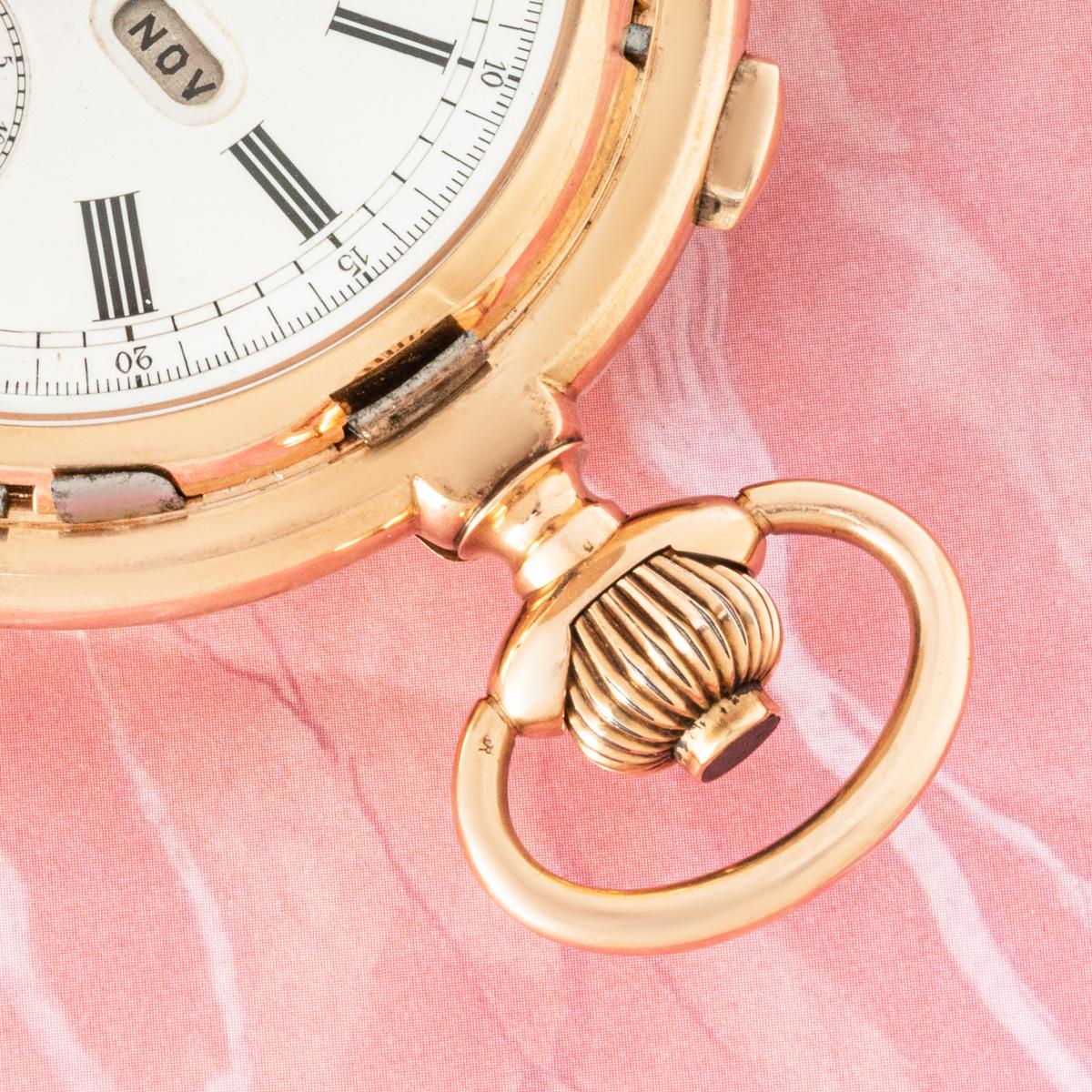 Le Phare An 14ct Rose Gold Minute Repeater Calendar Chronograph Keyless Lever Full Hunter Pocket Watch C1890s.

Dial: The white enamel dial with Roman numerals outer minute track, the subsidiary date dial located at twelve o'clock. The phases of the
