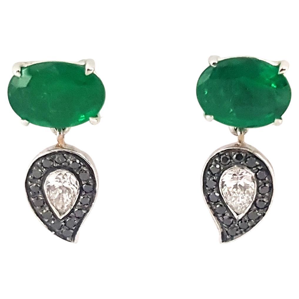 Le Phoenix Emerald Earrings Set in 18K White Gold Settings For Sale