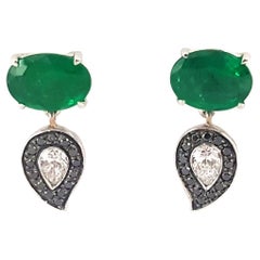 Le Phoenix Emerald Earrings Set in 18K White Gold Settings