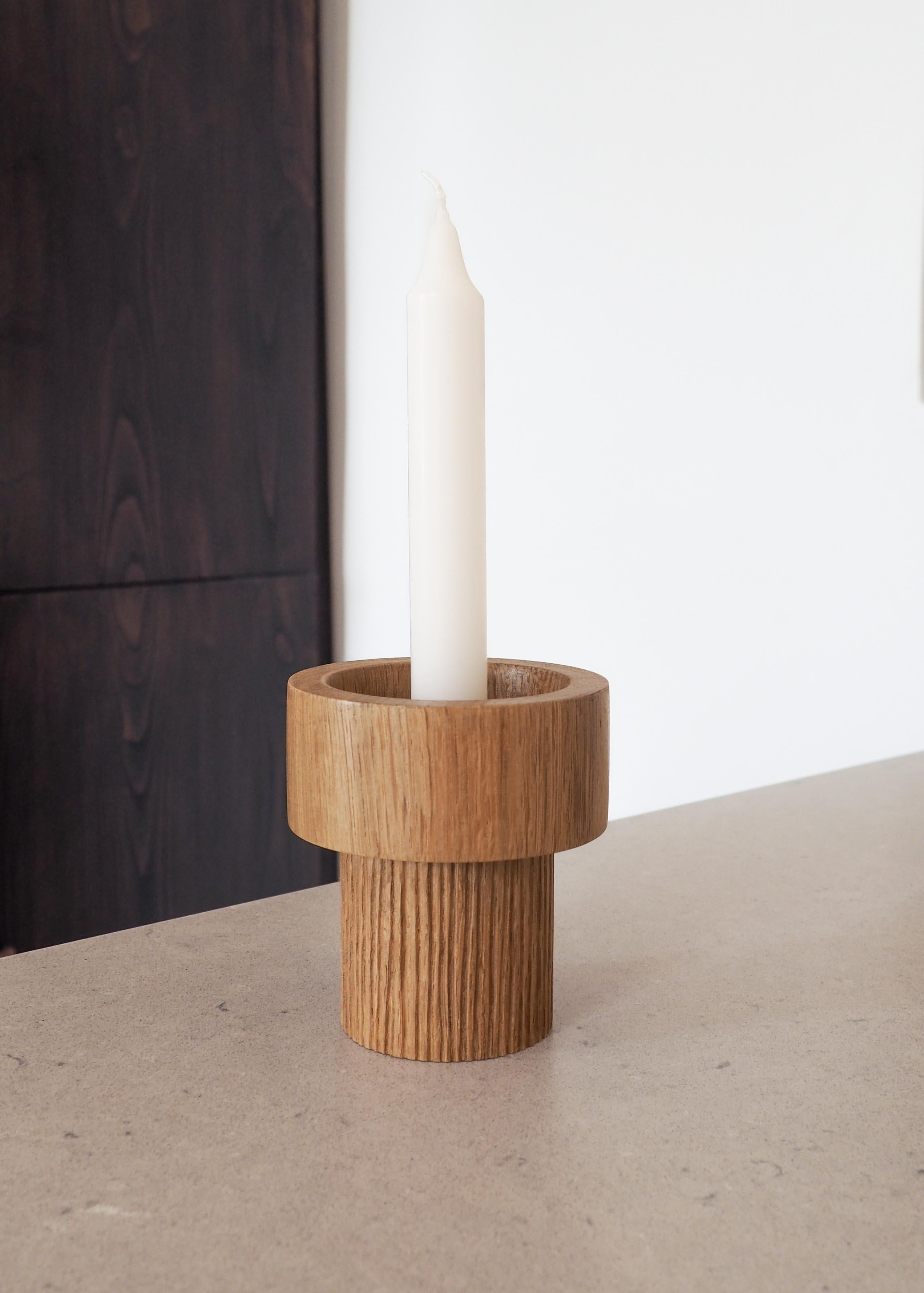 This oak candlestick was turned in the south of France. The gouge carving on the lower part adds texture to the piece. Its shape allows for different types of candles. A matt varnish has been applied to protect the wood without altering its natural