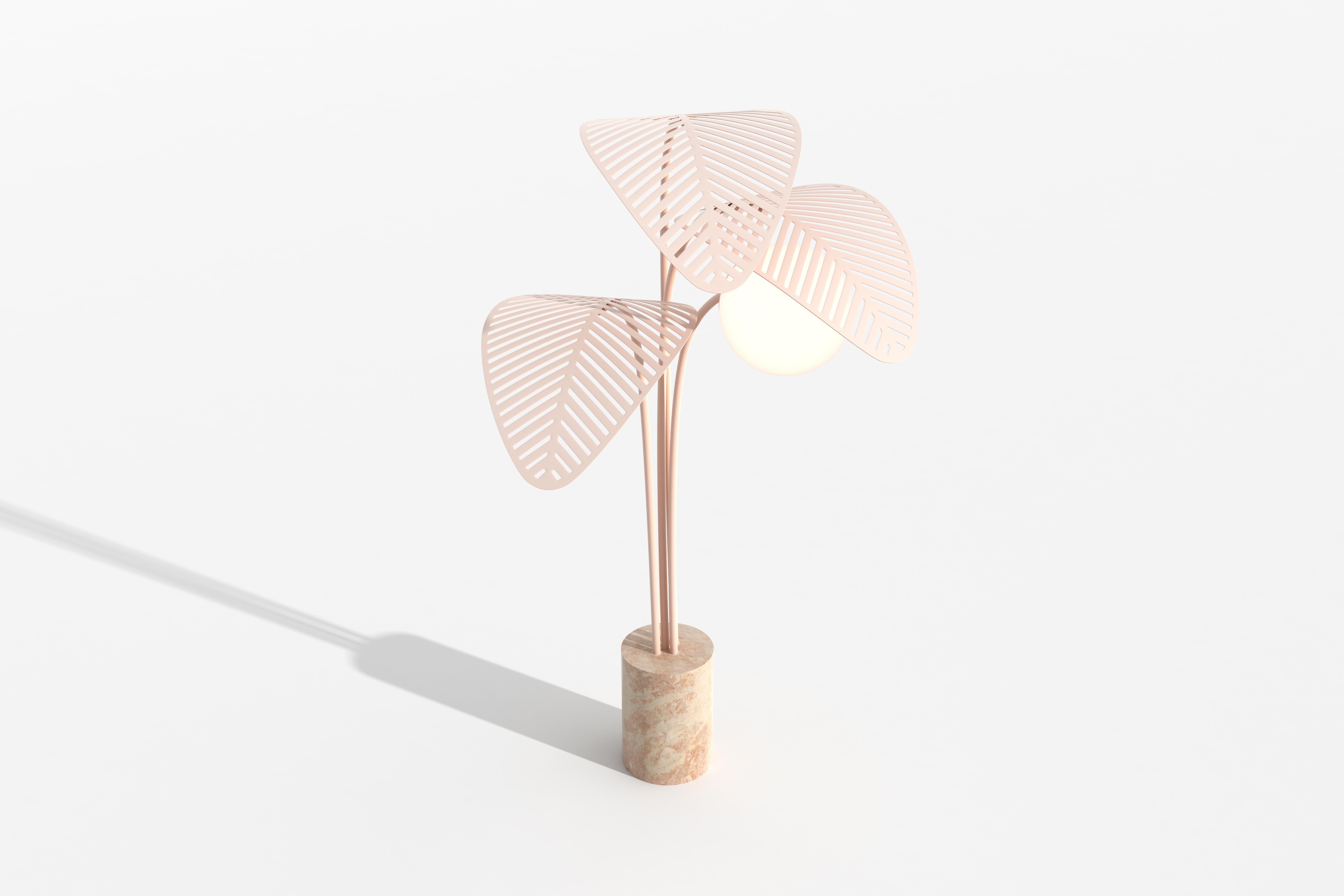 Floor lamp with Rosa Portogallo marble base, sheltered by 3 giant palm leaves, die-cut in metal and powder coated in satin pale pink.
Frosted lamp shade and dimmable light.

Designed by Parisian-Italian artist Marc Ange, who’s creations are