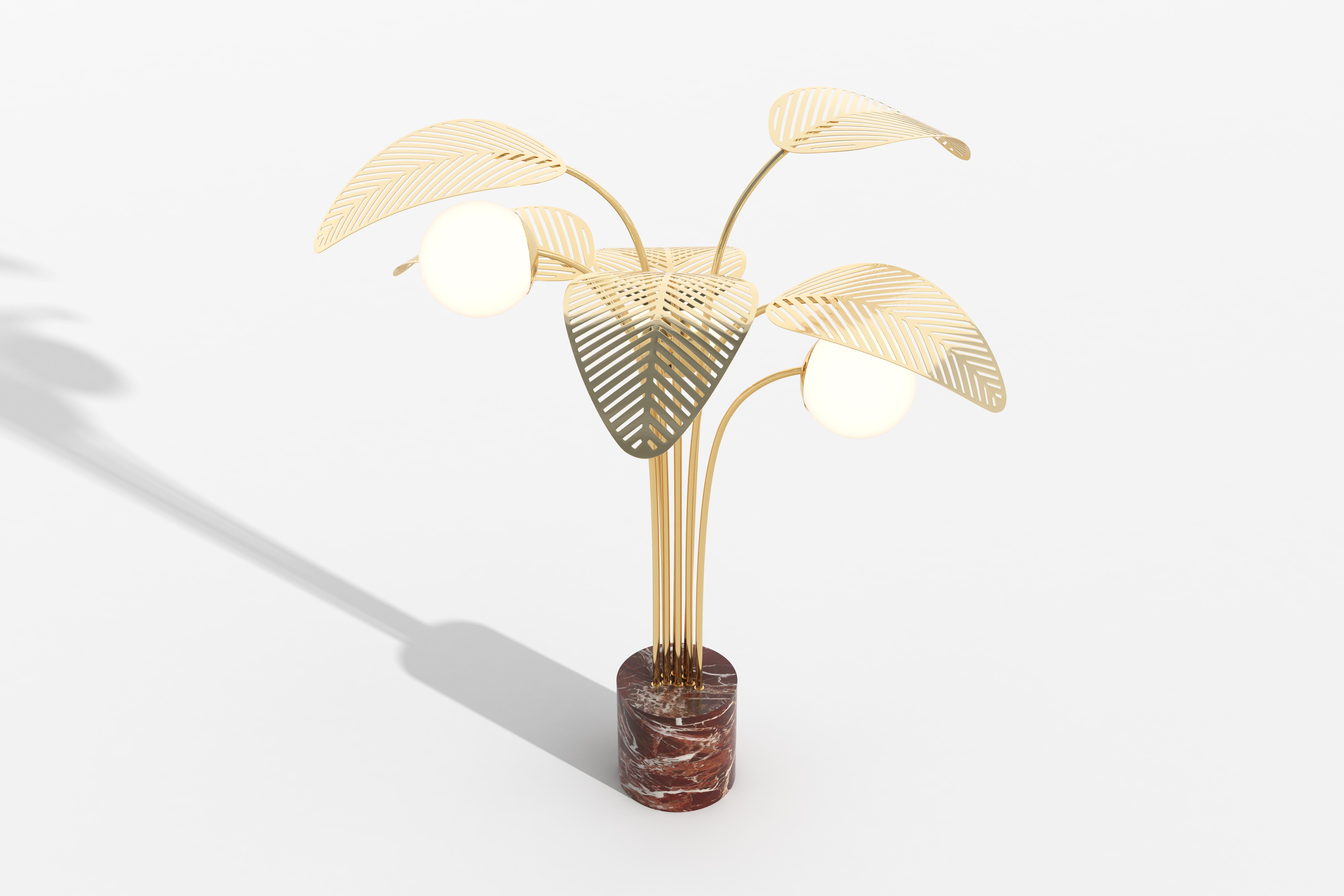 Floor lamp with Rosso di Francia red marble base, and six giant palm leaves, die-cut in high-gloss gold metal.
Frosted lamp shade and dimmable light.

Designed by Parisian-Italian artist Marc Ange, who’s creations are always balanced between real