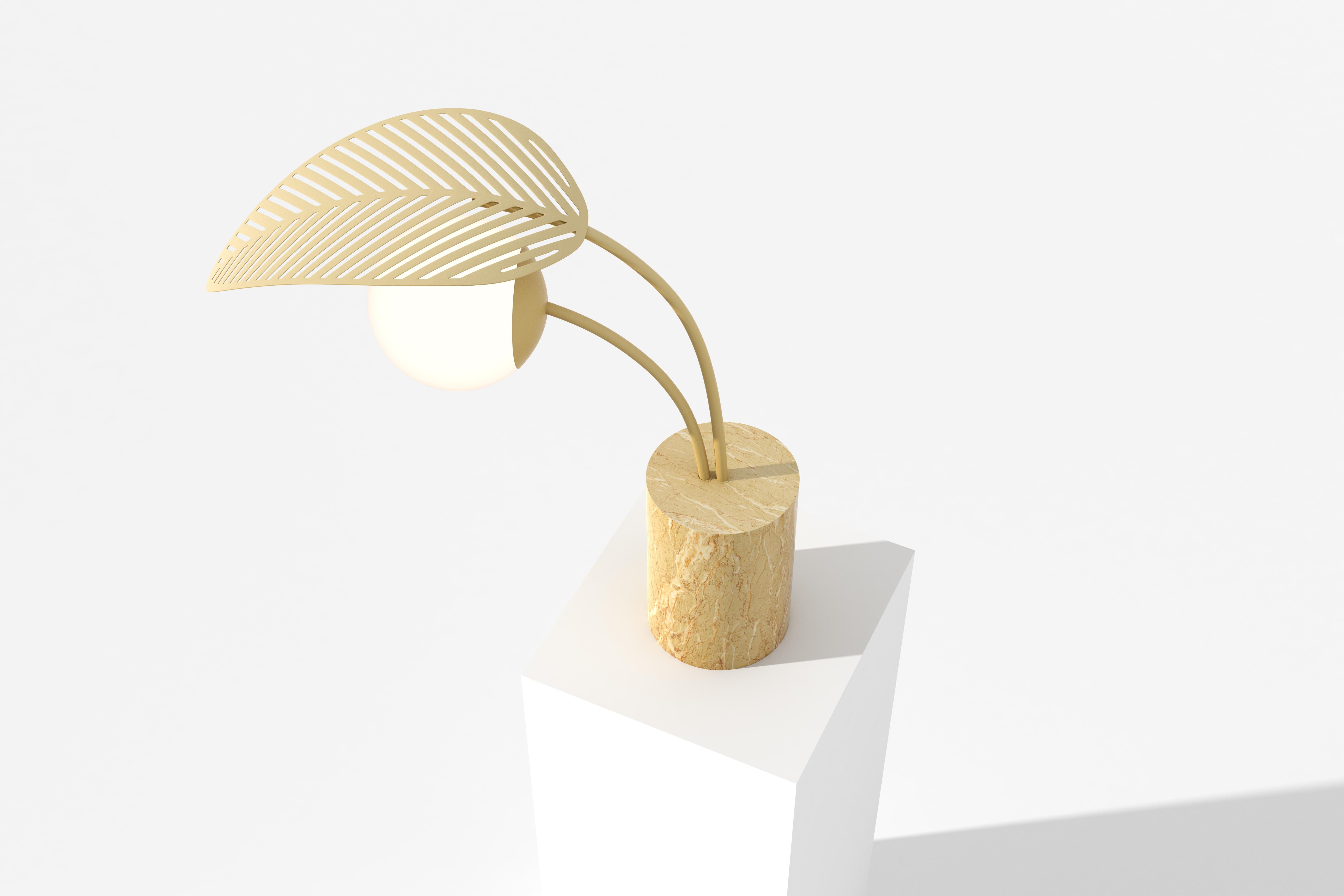 Floor lamp with Giallo d'Egitto gold marble base, sheltered by one palm leaf, die-cut in metal and powder coated in satin pale yellow.
Frosted lamp shade and dimmable light.

Designed by Parisian-Italian artist Marc Ange, who’s creations are