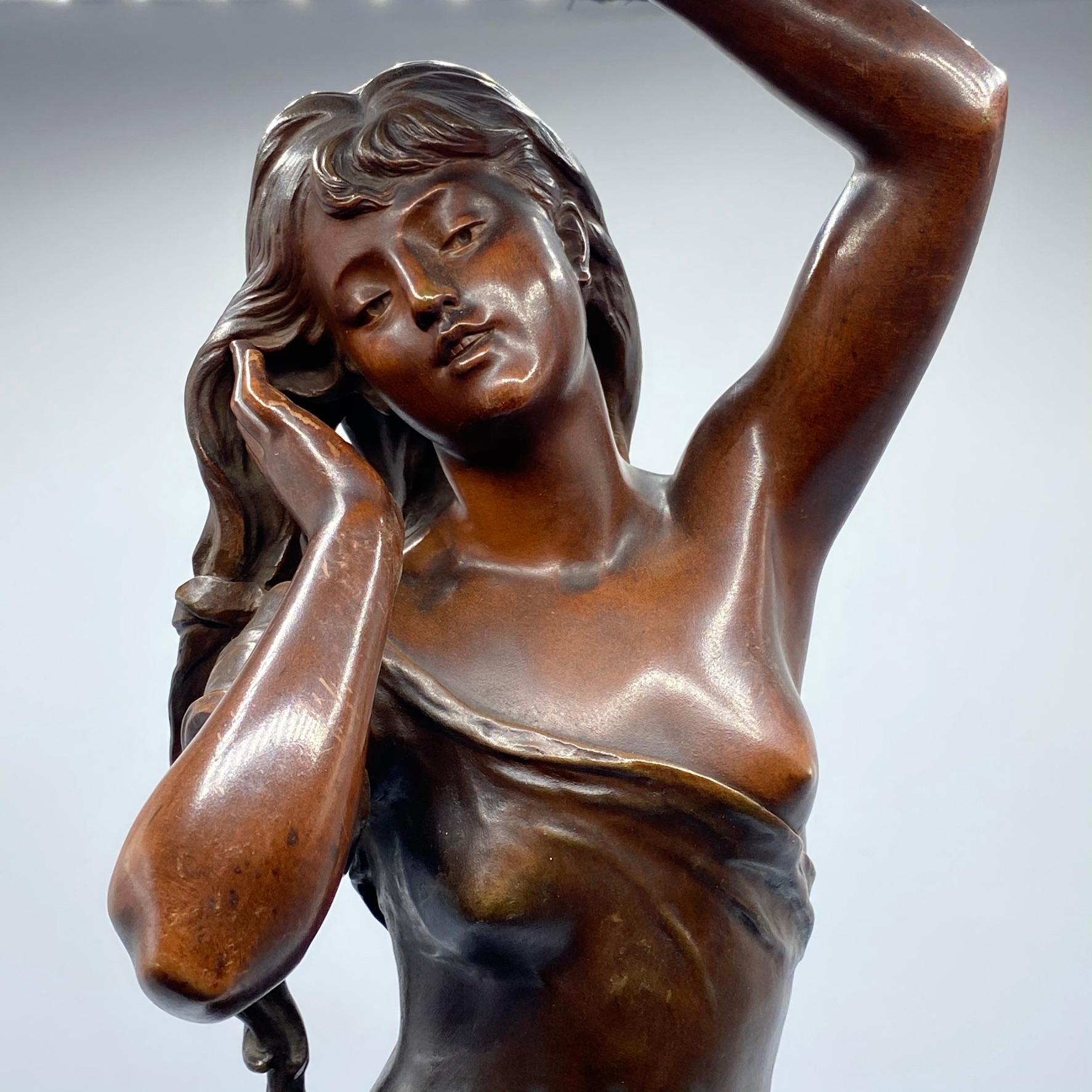 Fine quality 19th century French Le Reveil Figurative bronze sculpture after Hippolyte Francois Moreau on the original swivel bronze base.
