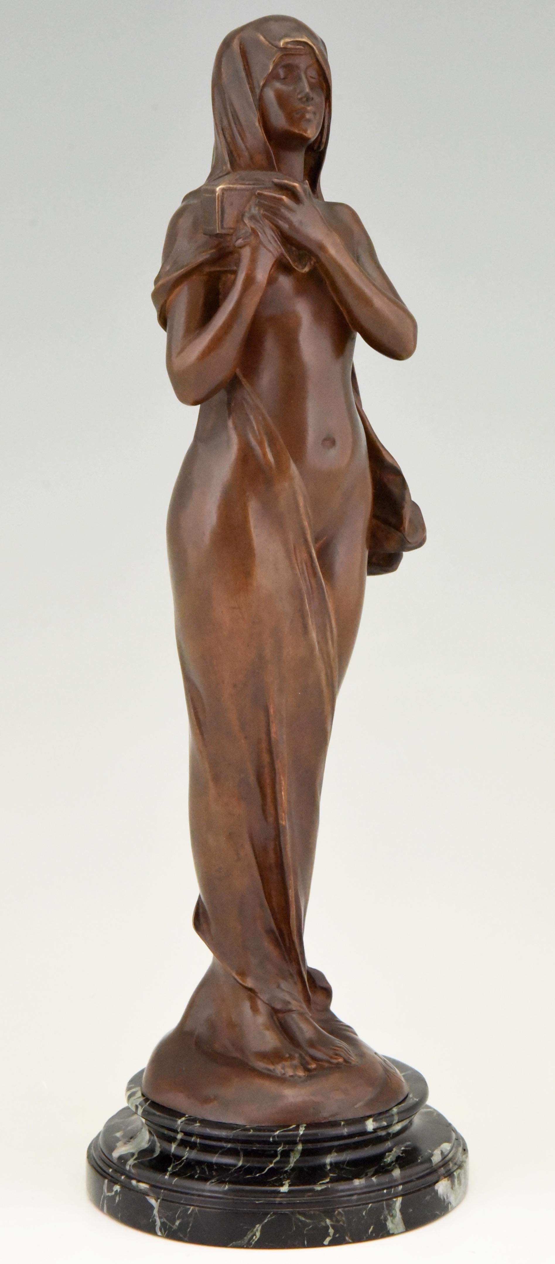 Le Secret, Art Nouveau bronze sculpture of a standing veiled nude holding a jewelry casket by the famous French sculptor Maurice Bouval who was born in Toulouse (1863- 1916)
The bronze has a lovely brown patina and stands on a circular dark green