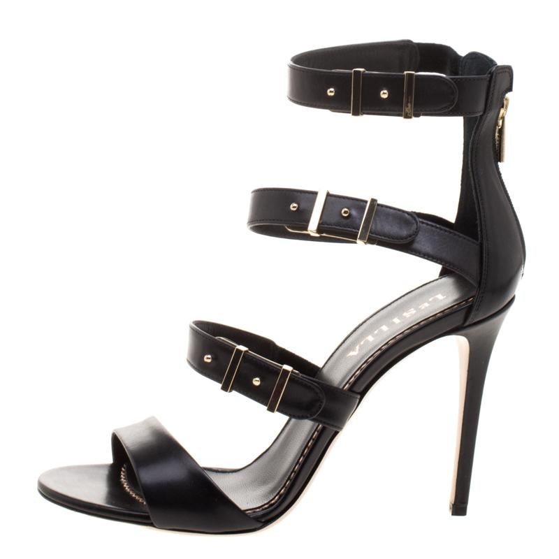We've fallen head over heels in love with these sandals from Le Silla. Crafted from leather, they've been styled with straps and gold tone buckles. They carry an open toe, with rear zippers and stiletto heels. So high fashion, this pair will