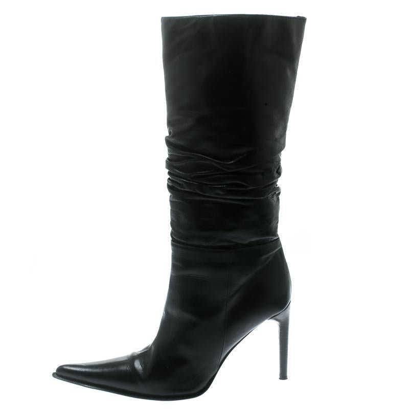 A perfect pair of calf-length boots will instantly transform your look into an extremely chic and glamorous look, just like these Le Silla boots. Constructed in black ruched leather, this pair features pointed toes and sophisticated cuts along with
