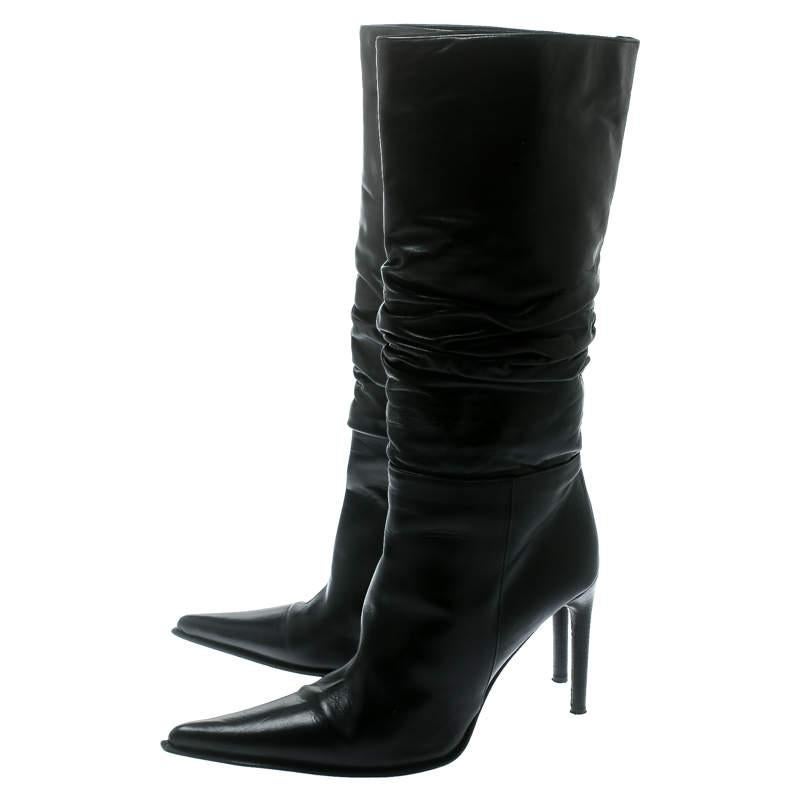 A perfect pair of calf-length boots will instantly transform your look into an extremely chic and glamorous look, just like these Le Silla boots. Constructed in black ruched leather, this pair features pointed toes and sophisticated cuts along with