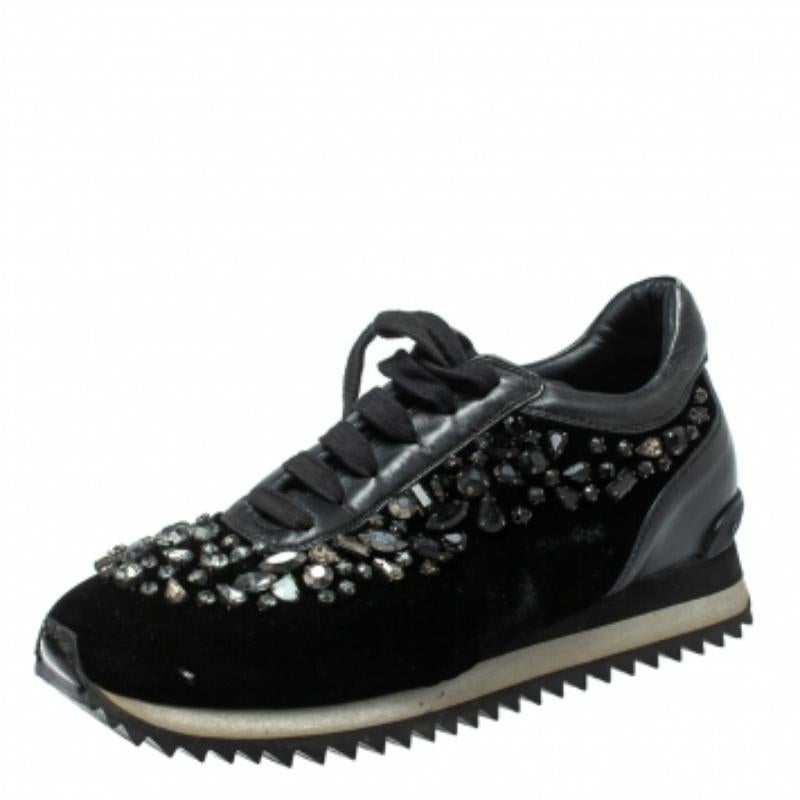 These amazing sneakers from Le Silla will elevate your look. Step out in style and confidence as you wear these attractive low-top sneakers. They carry a black-hued exterior made from velvet and leather. They are styled with laces, crystal