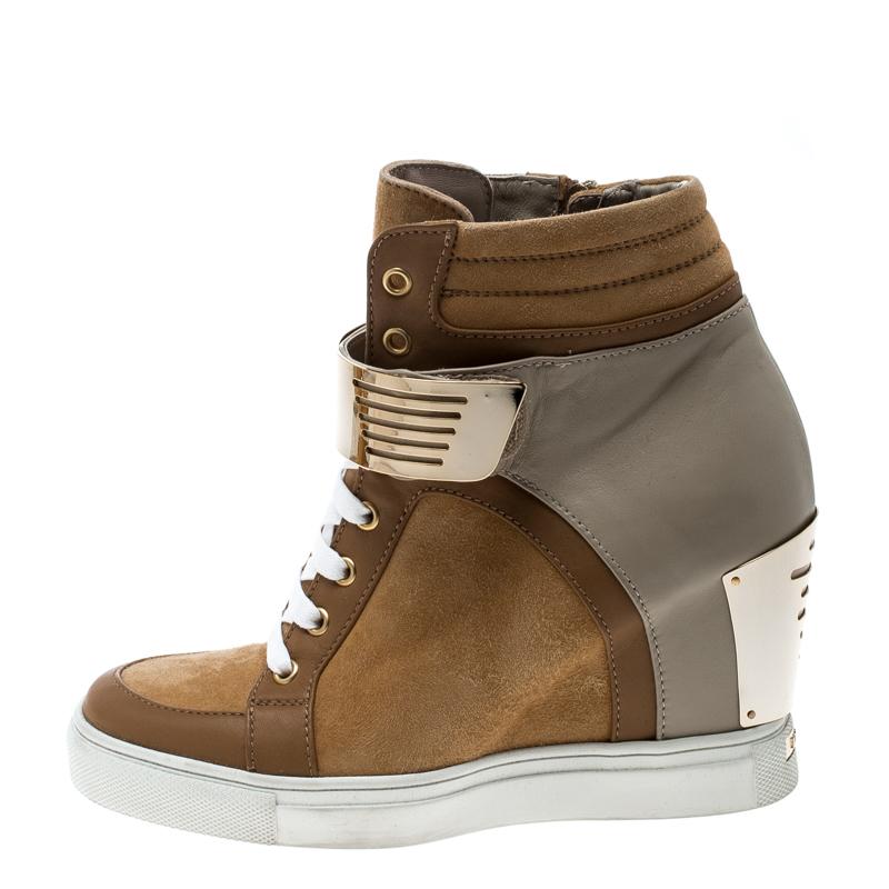 Whether you are travelling or simply out and about in the city, these Le Silla In Chipow sneakers are a perfect choice. It is designed in a brown and grey hues with a mix of leather and suede and detailed with lace-ups, metal straps and metal