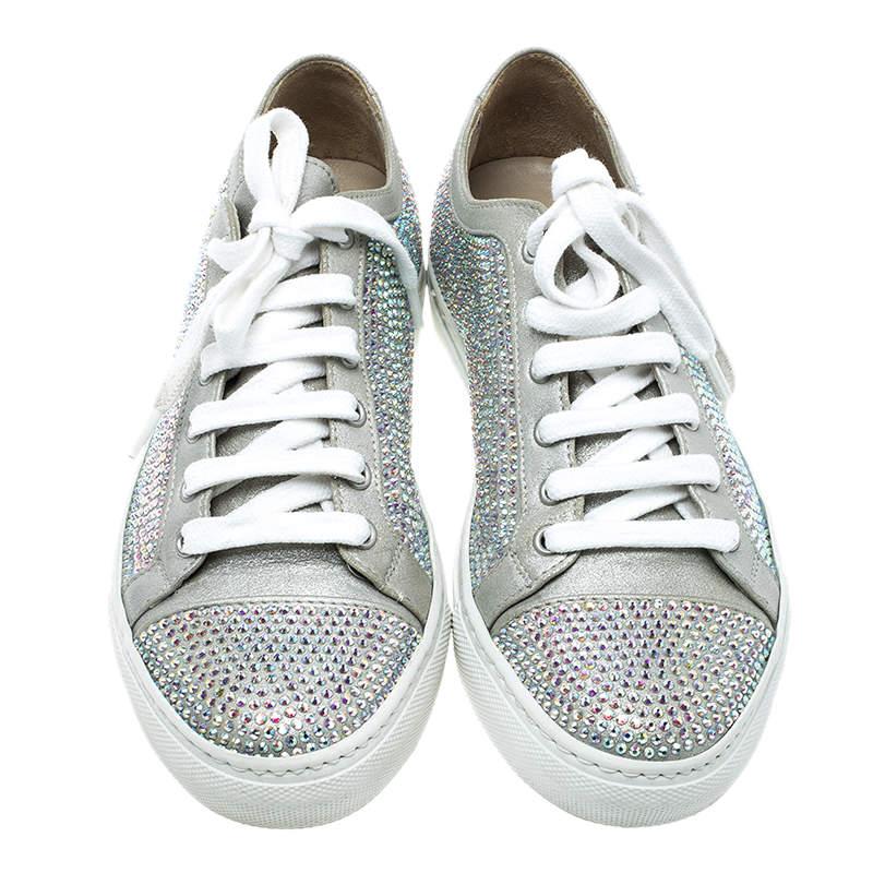 Jazz up your party looks or stand out with your casual outfits wearing this stunning pair of Le Silla lace up sneakers. Designed in grey suede with crystal embellishments all over the surface, these shoes feature silver leather trimming and white