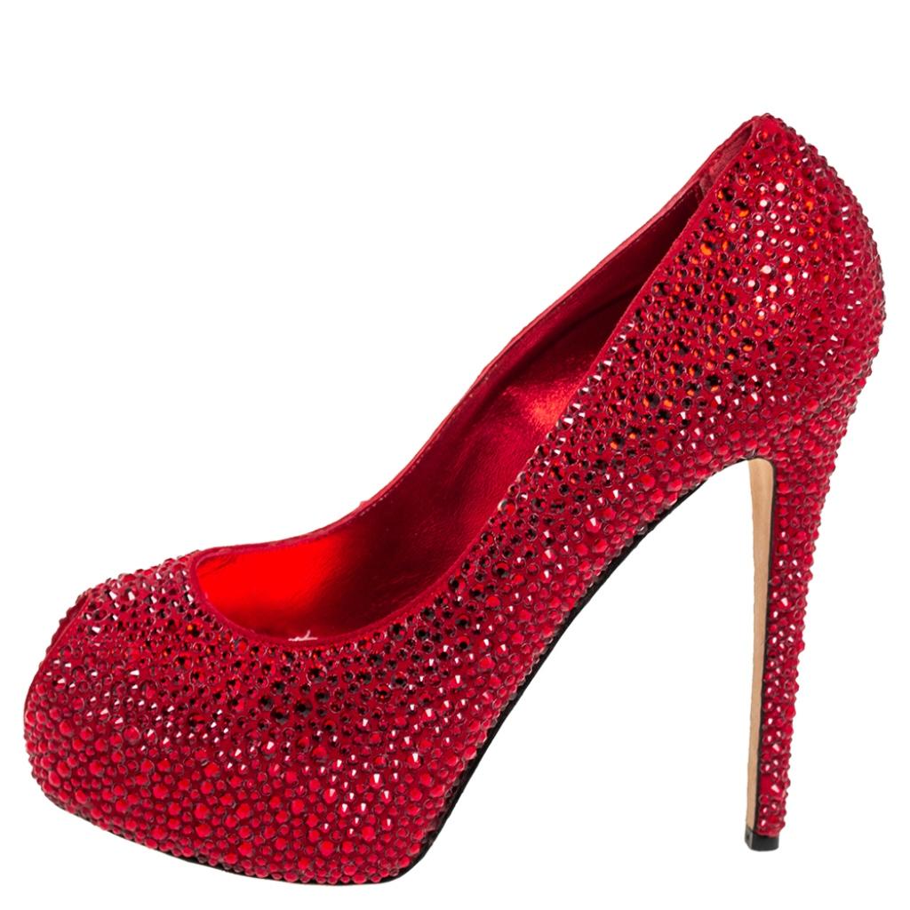 An exclusively designed pair for you to help you make a statement! These Le Silla pumps are crafted from metallic red suede and styled with peep-toes. They are decorated with crystal embellishments all over and come equipped with comfortable