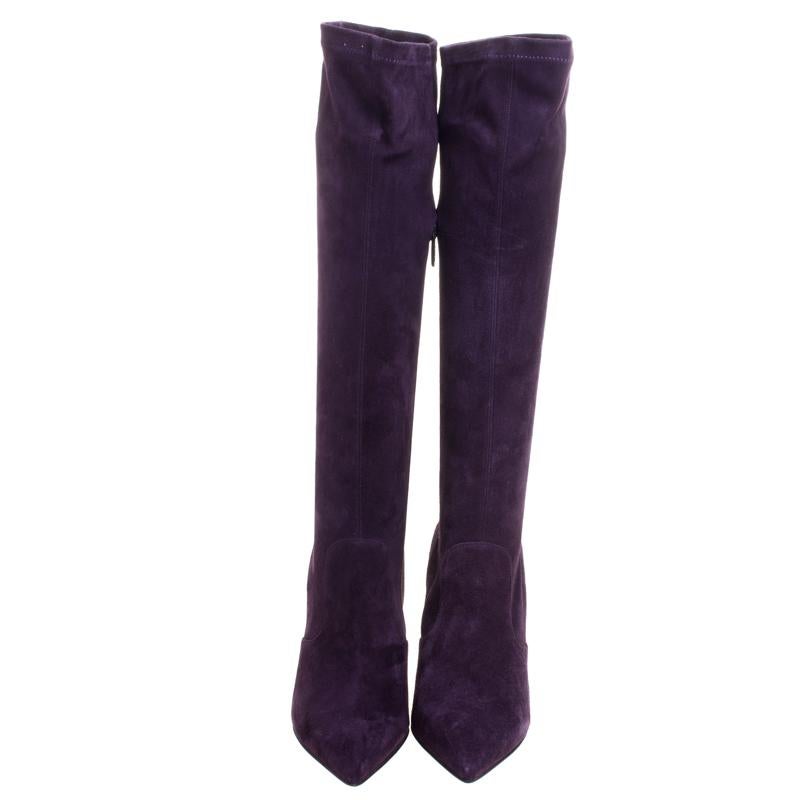 Take a look at this lovely pair of Le Silla boots that speak style with its silhouette and simple design. They've been crafted from velvet in a lovely purple shade with a knee-high style. They also feature pointed toes, 10 cm heels, and comfy