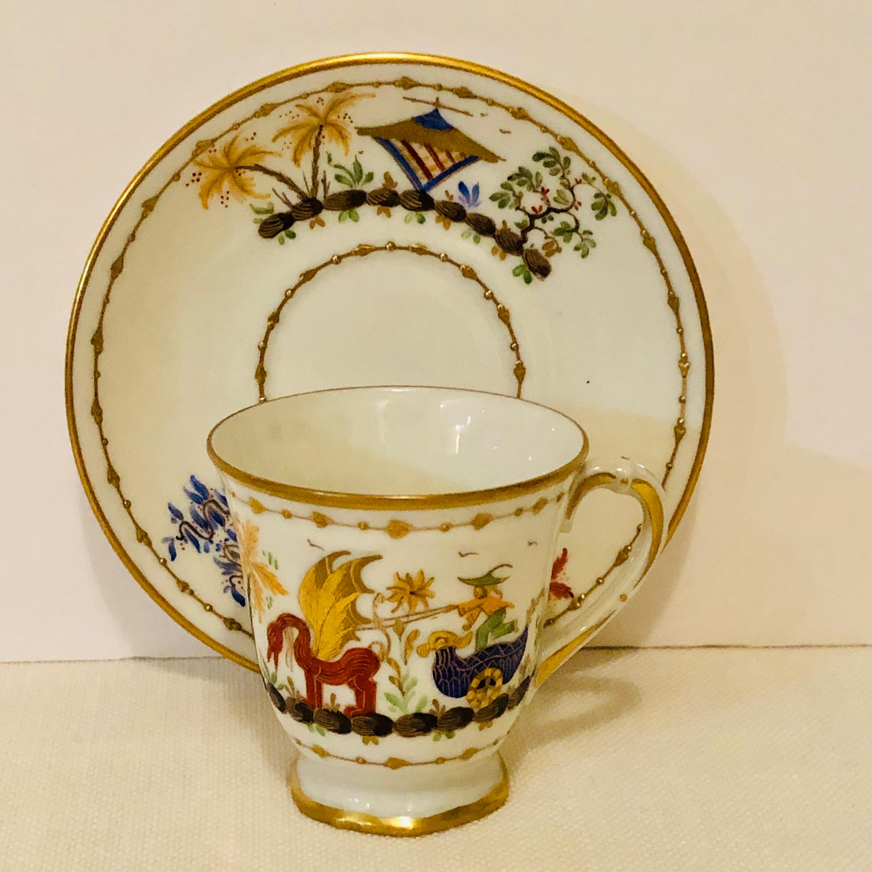This is a wonderful Le Tallec demitasse cup and saucer in the Cirque Chinois pattern. This cup is hand painted with a whimsical chinoiserie scene which has raised gold accents on a white ground. This cup and saucer was decorated by the Le Tallec