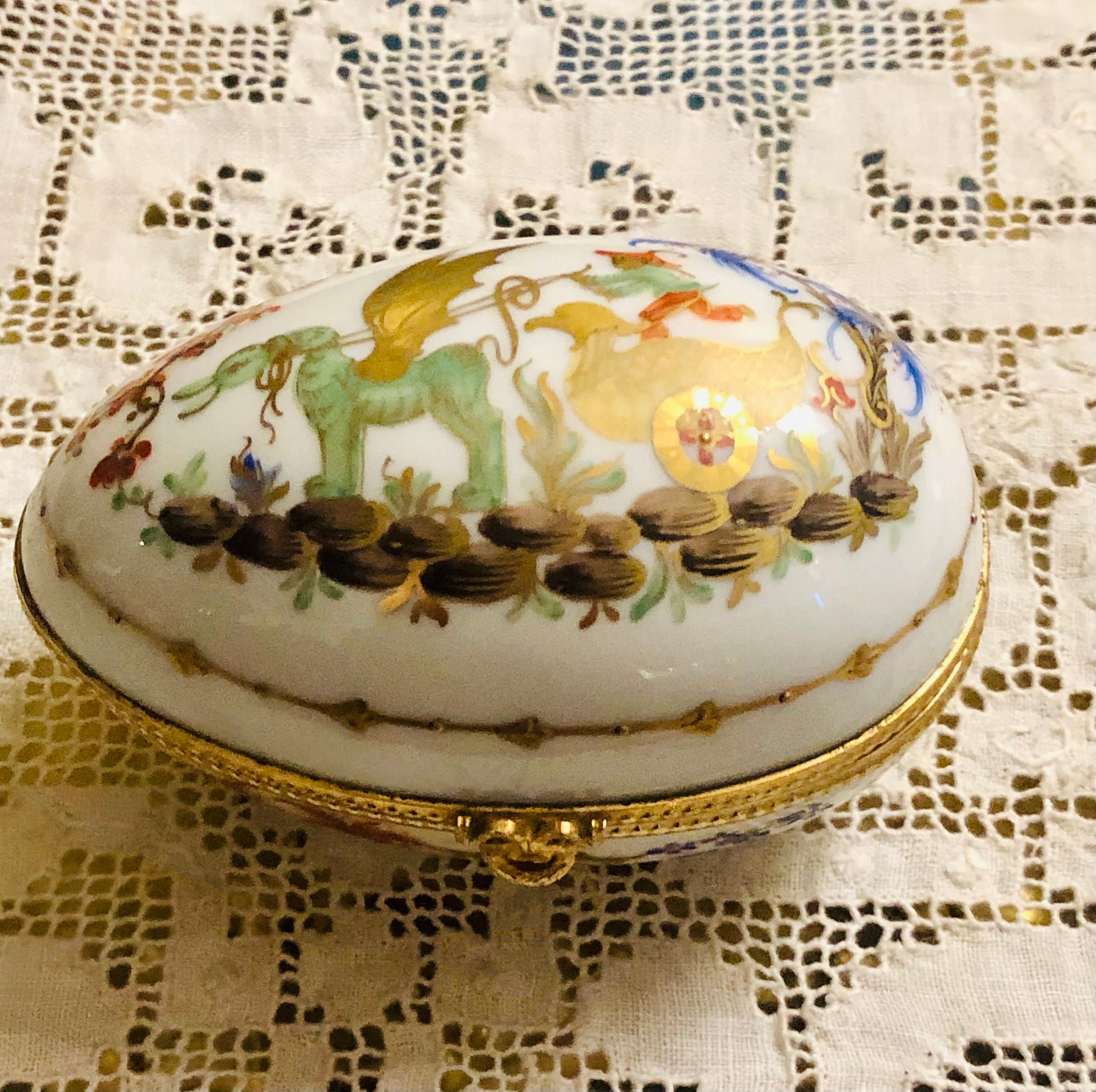 I am offering you this wonderful whimsical Le Tallec porcelain box in the Cirque Chinois pattern on a white ground. It has chinoiserie decoration with accents of raised gilding. It is 4 inches wide. It was made by Le Tallec of Paris, which later