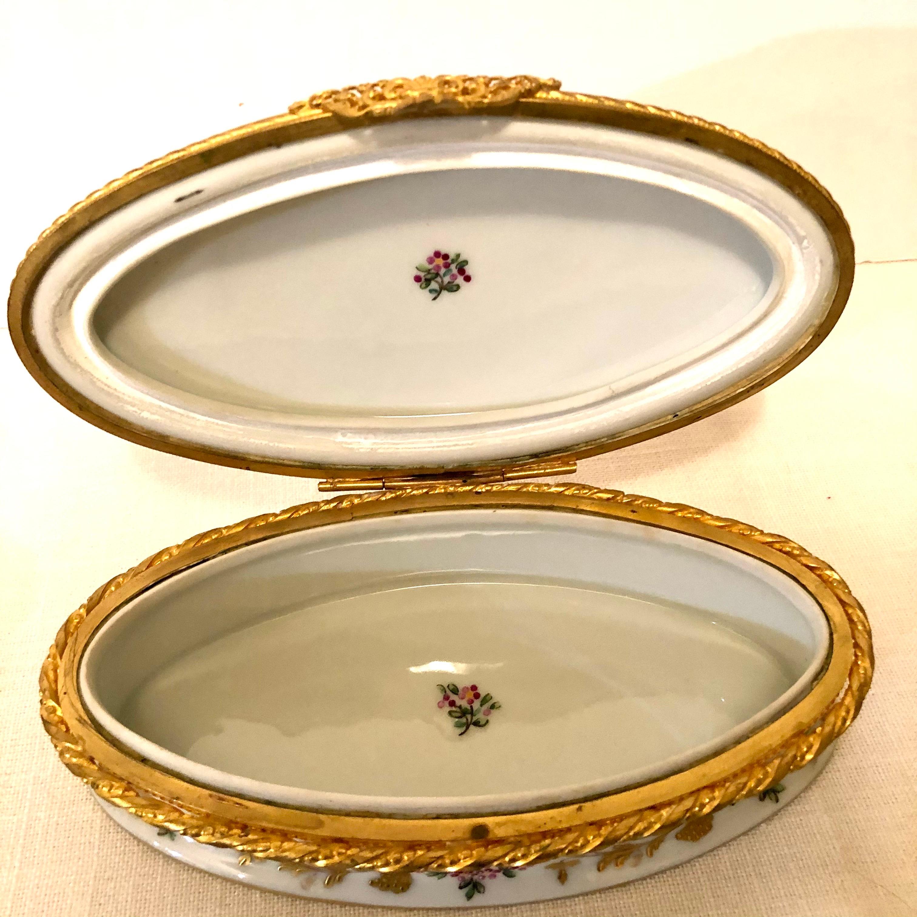 Le Tallec Oval Box with Raised Gilded Leaves & Raspberries and Ribbon of Flowers 1