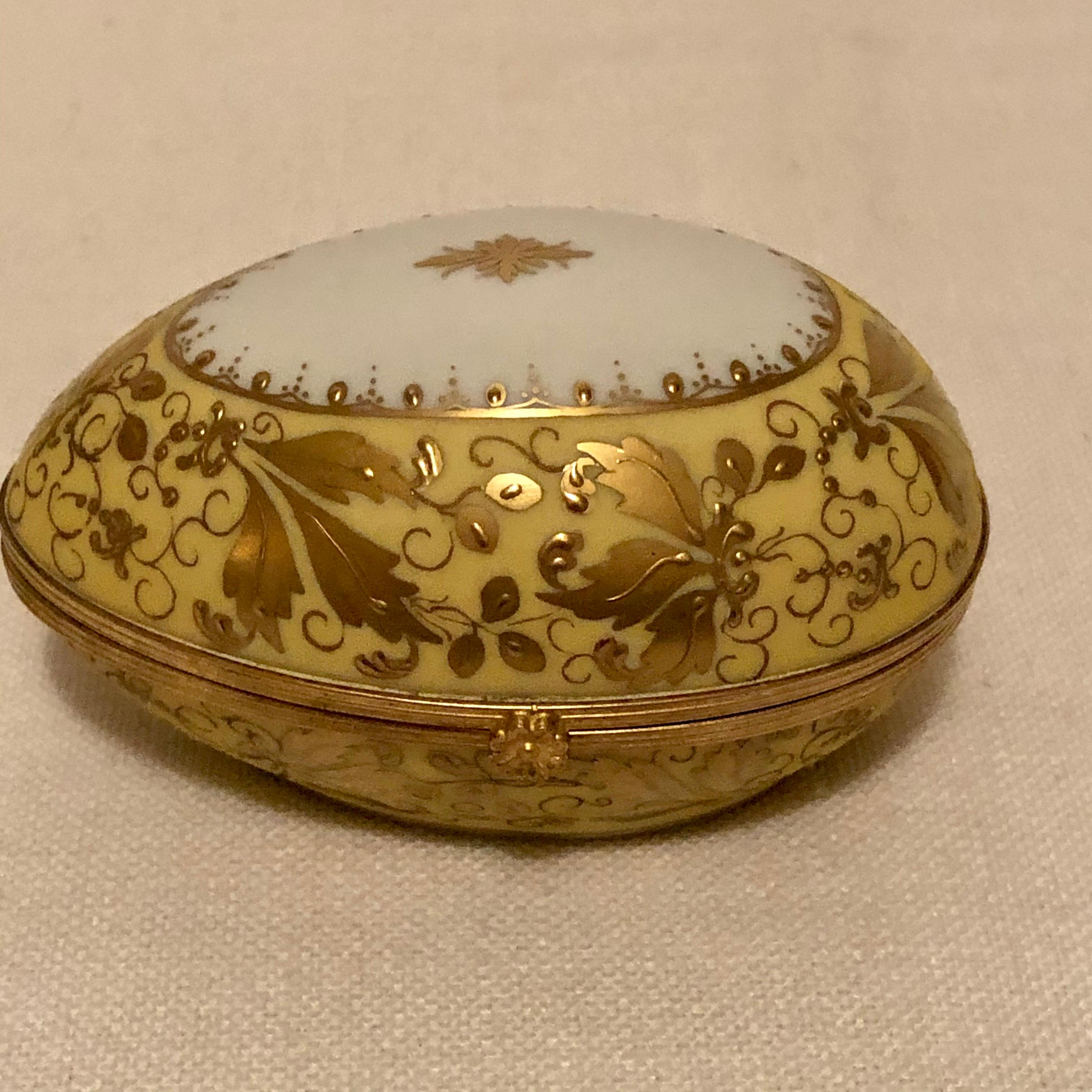 This is a wonderful Le Tallec egg shaped box, which is decorated with elaborate raised gilding and gilt jeweling. Look at the pictures to see the intricate raised gilding decoration all over this egg shaped box. This box was decorated in the studio