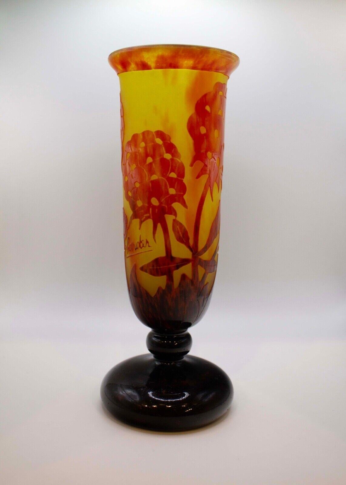 A timeless Art Nouveau acid etched cameo glass with floral design vase known as the Pivoines design by Le Verre Francais. France, circa 1925. Etched signature to top of base Charder Le Verre Français. An elegant glass design in warm colored tones.