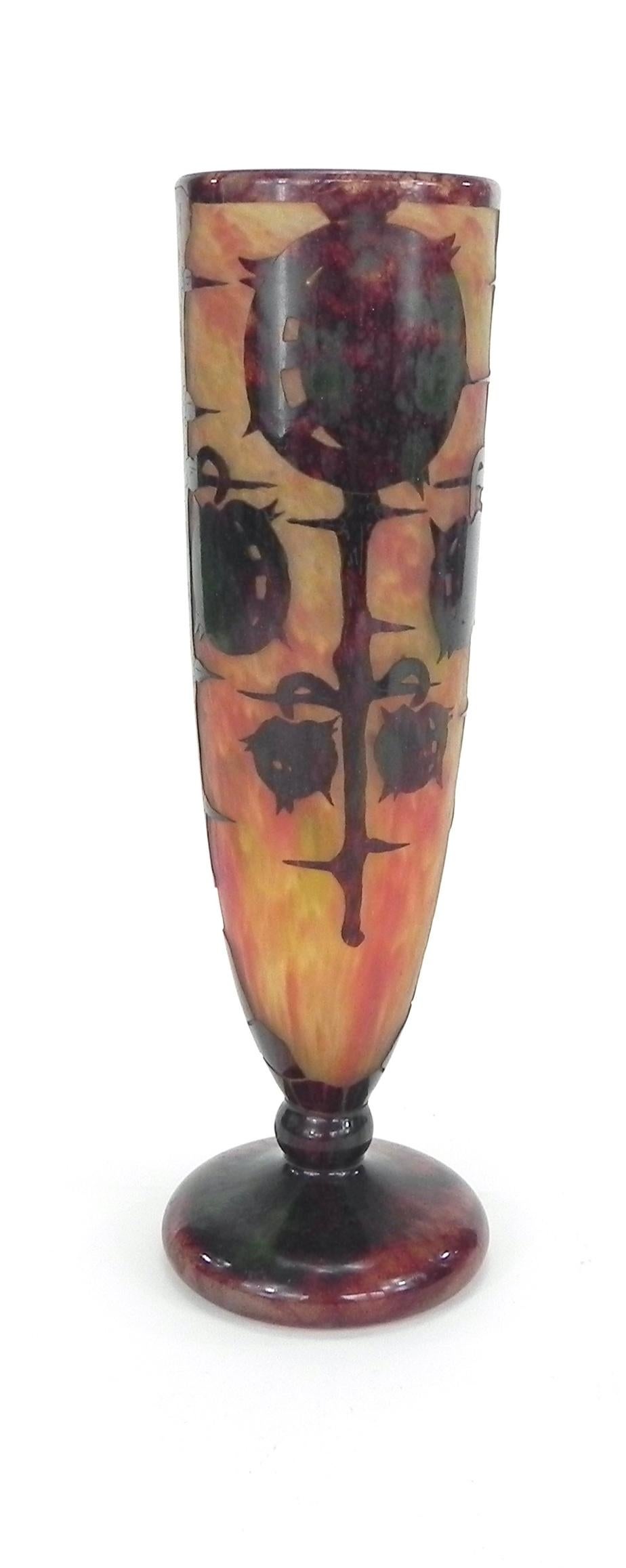 A tall narrow pedestal “Le Verre Francais” cameo art glass vase (ca. 1922-25) decorated with chestnuts (marrons) by the master French glass designer Charles Schneider (1881-1953). This superbly crafted acid-etched flute-shaped vase done in the Art