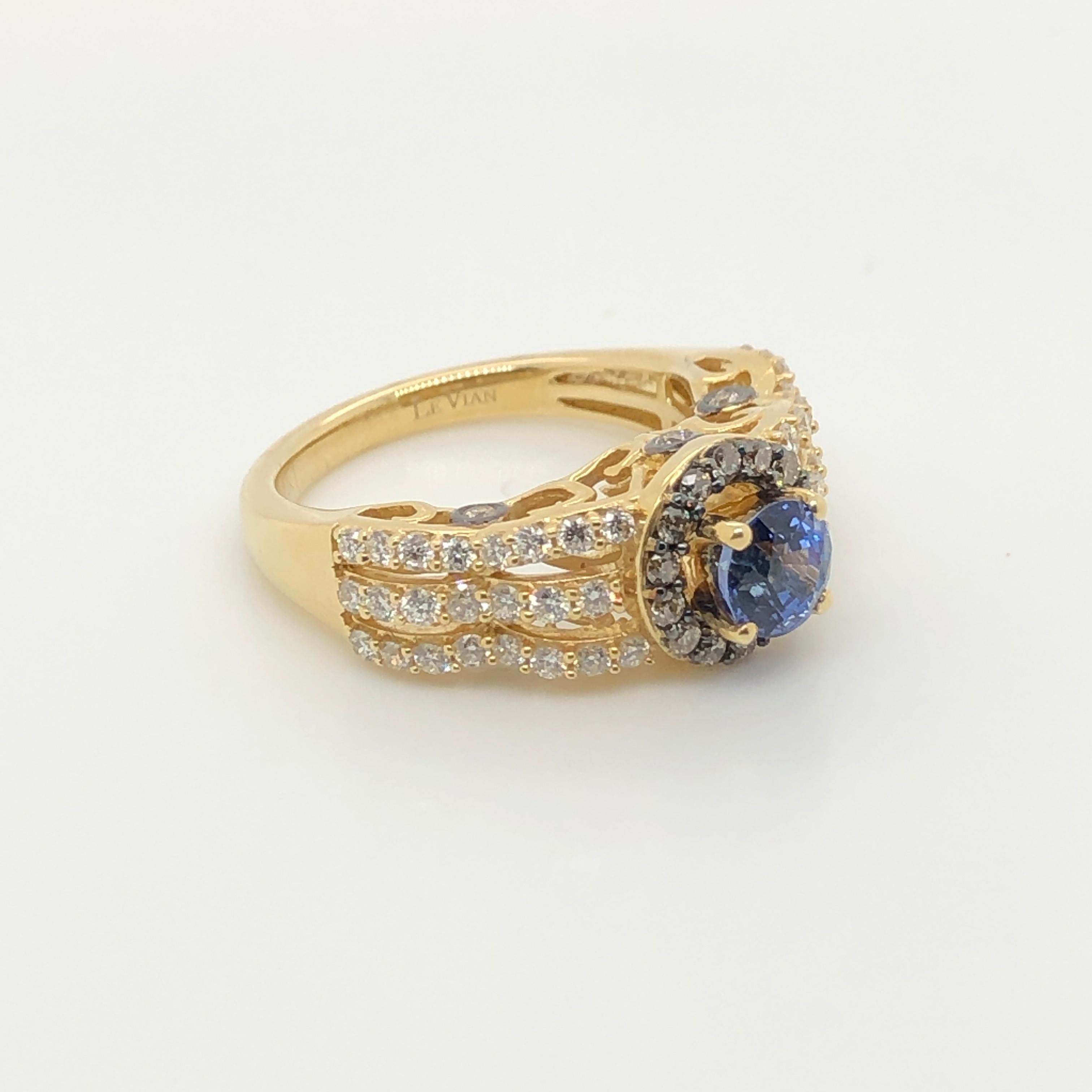 This Le Vian Bridal ring in 14k yellow gold is centered with a 1-carat Ceylon Sapphire, one of the most prized sapphires favored for its cornflower hue, framed with 1/3 ct t.w. Chocolate Diamonds and banded with a triple row of Vanilla Diamonds (5/8
