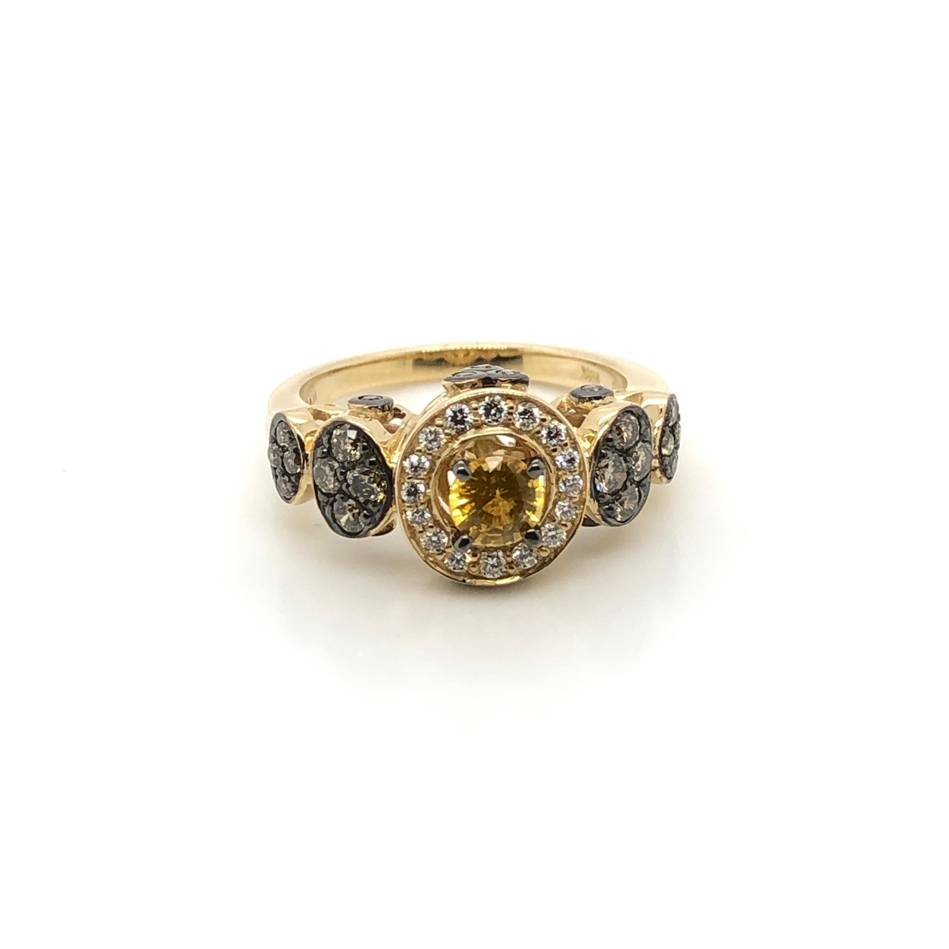Sweet with sunshine!  This 14k yellow gold Le Vian Chocolatier ring is centered with a 1/2-carat round cut Yellow Sapphire framed within a halo of Vanilla Diamonds (1/6 ct.t.w) with round circles of 1/2 ct t.w. Chocolate Diamonds creating the