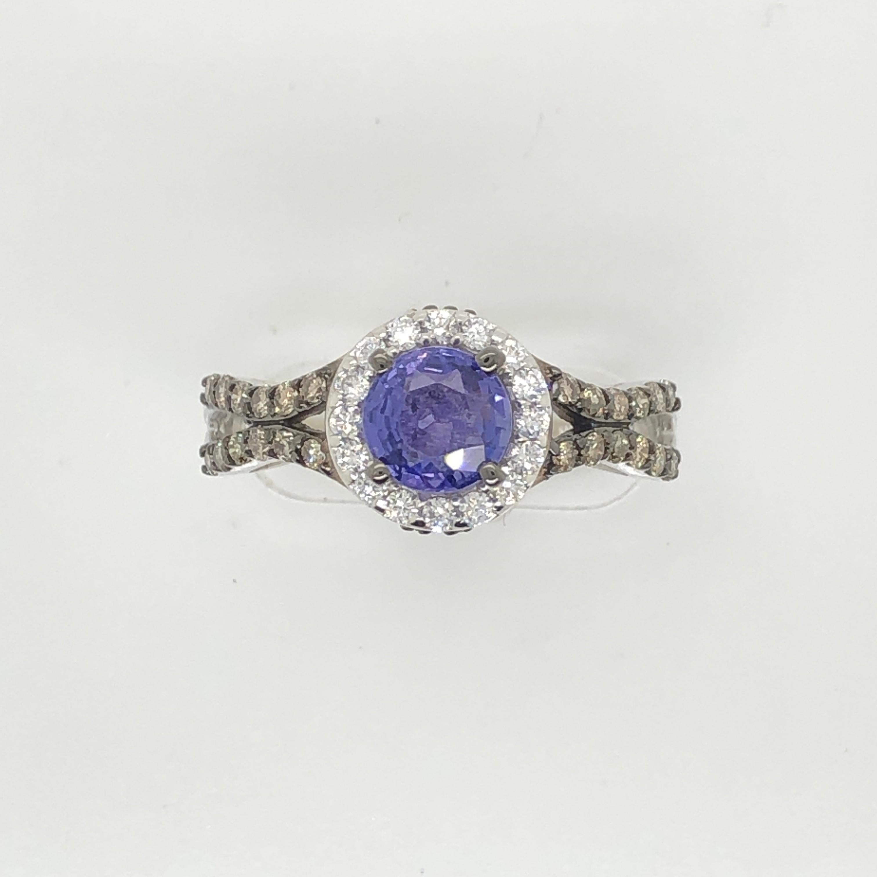 Today's bride craves color! This Le Vian Bridal 14k gold design features a 1-carat round Purple Sapphire center within a halo of Vanilla Diamonds and a band studded with 1/2 ct t.w. of Chocolate Diamonds. 
Ring Size: 7