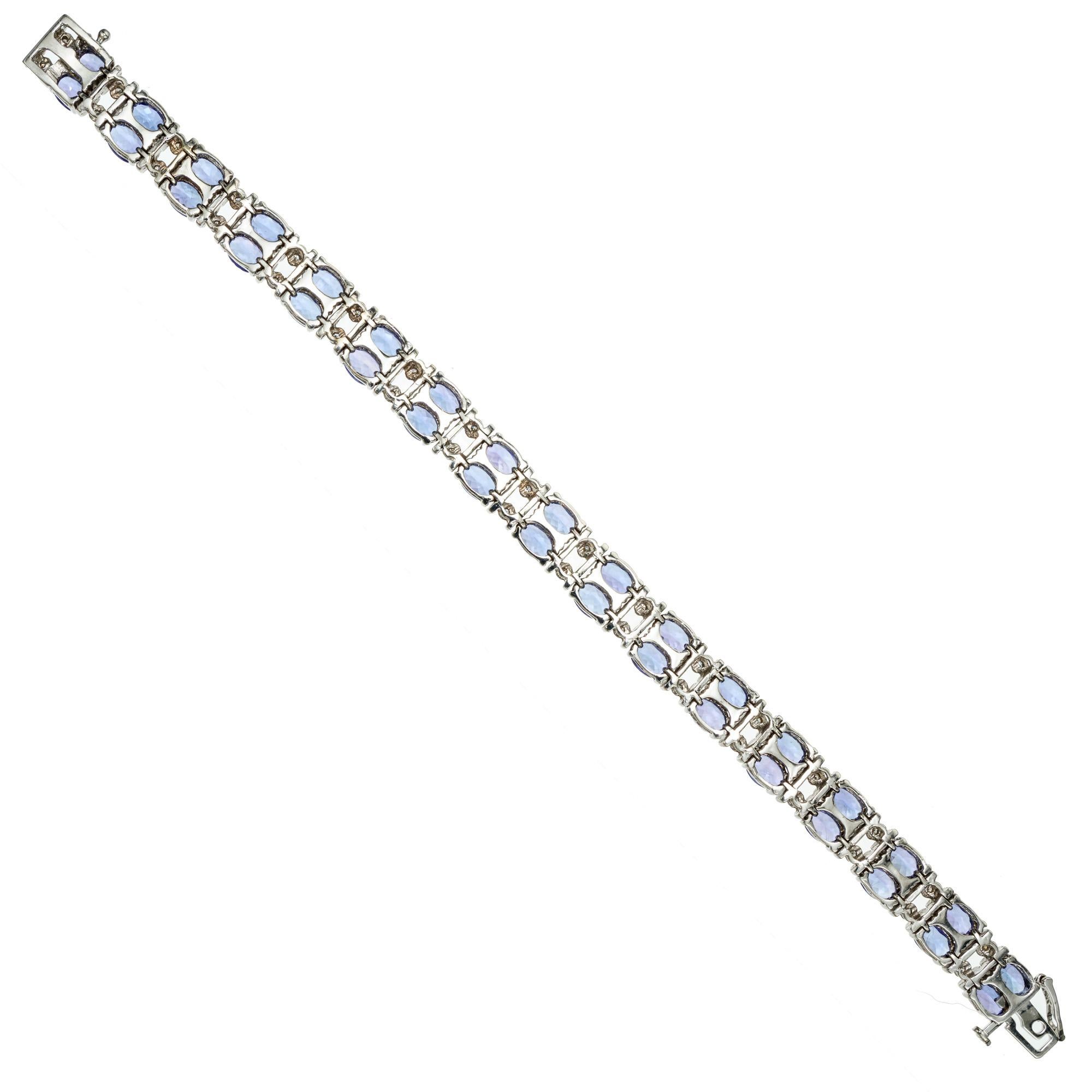 Tanzanite and diamond link bracelet. This spectacular Le Vian bracelet boasts 34 oval tanzanite's in a double row design with each set of tanzanite's spaced by double round cut diamonds set in 14k white gold. The 34 Tanzanite's total approximately