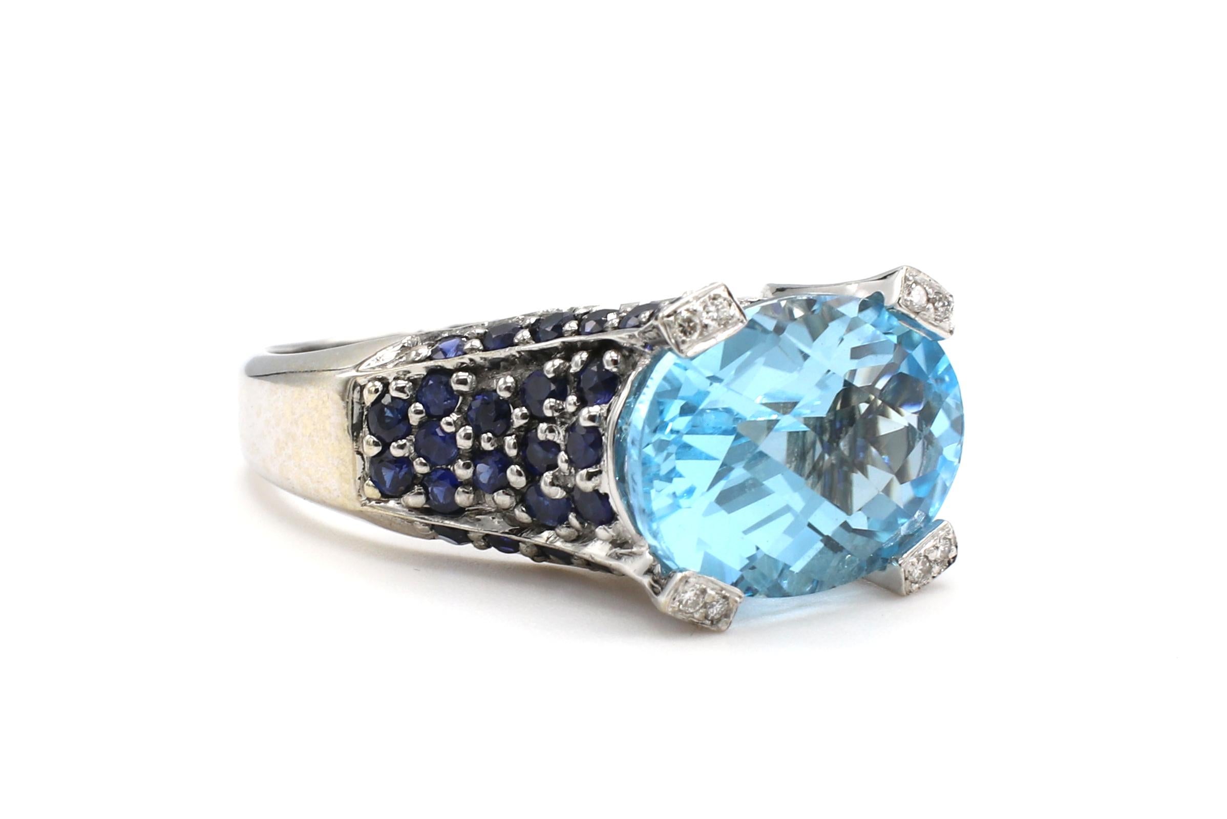 Le Vian 14 Karat White Gold Blue Topaz & Sapphire & Diamond Cocktail Ring 
Metal: 14k white gold
Weight: 8.44 grams
Diamonds: Approx. .10 CTW G-H VS
Topaz: Oval, blue, 14 x 10.2mm
Sapphires: Approx. 1 CTW
Size: 7.75 (US)
Height from finger: 8.5mm
