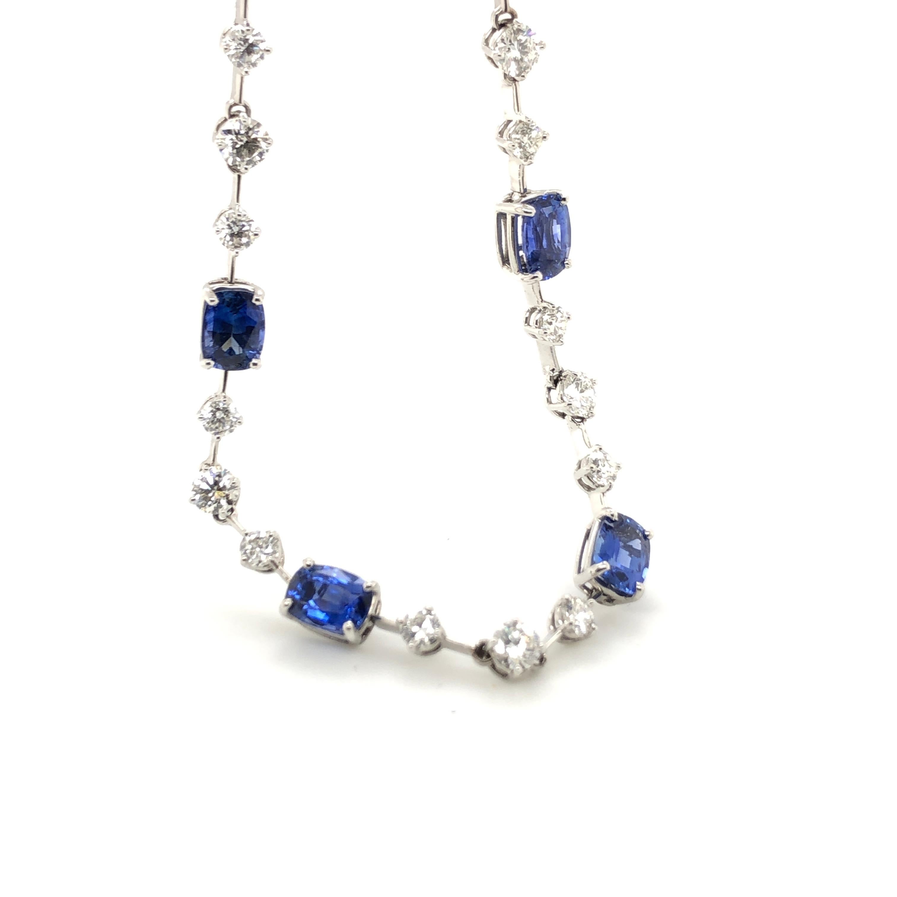 A MUST HAVE for style conscious fashionistas who love blue gems! 
This gorgeous 18k White Gold Sapphire Necklace with 9.75 Carats of Blue Sapphire and 5.75 Carats of White Diamonds.