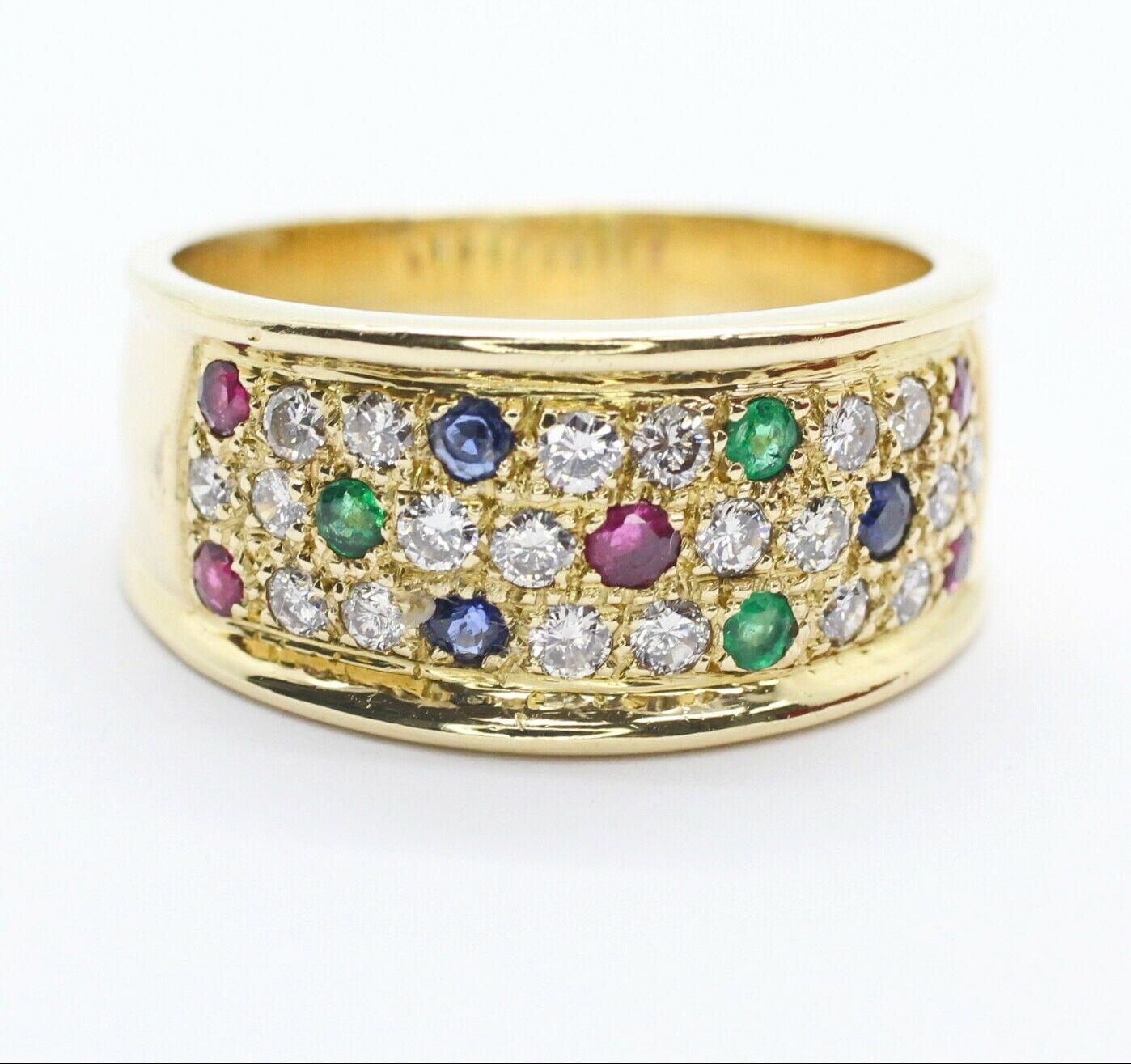 Le Vian wide band ring features a 20 pieces round cut diamonds in approximately 0.40 carat total weight in G color and SI1 stone clarity. This ring has different kind of gemstone Blue sapphire, Ruby and Emerald, this band crafted in 18K yellow gold