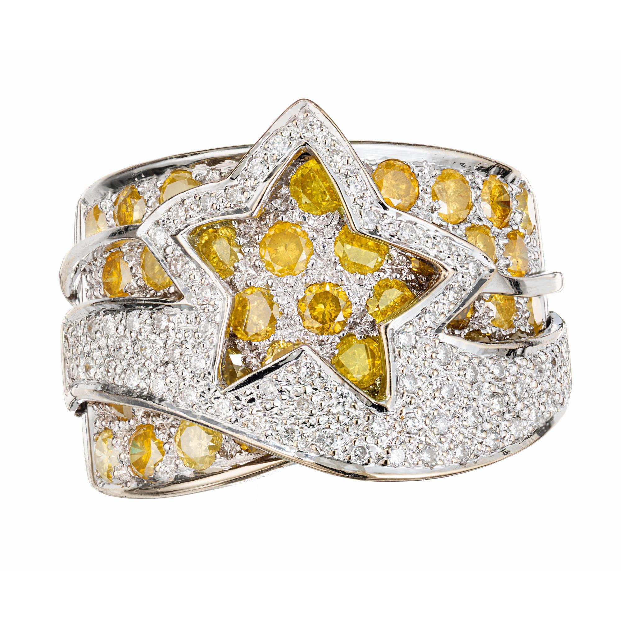 Boldly styled Le Vian star design band cocktail ring. 38 round yellow diamonds approximately 2.00cts set in a 18k white gold wide band with an overlay star design halo set with 67 round pave set diamonds. This intricate and beautifully cocktail
