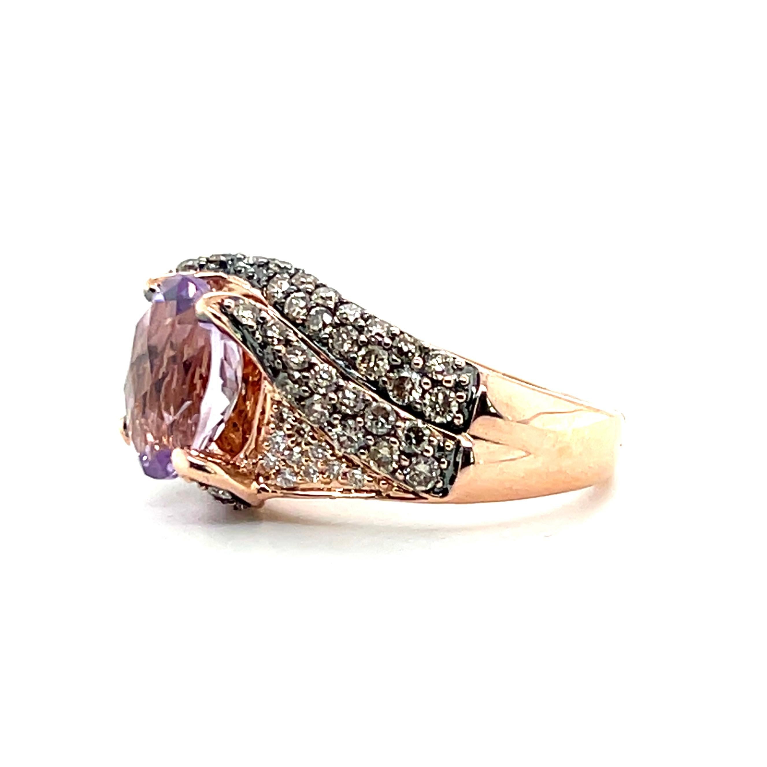 This contemporary Le Vian ring is crafted in 14 karat rose gold and features a 2.27-carat oval amethyst with a delicate, lighter purple hue. The amethyst is accented by sixty-eight round brilliant brown diamonds, approximately 1.05 total carats, and