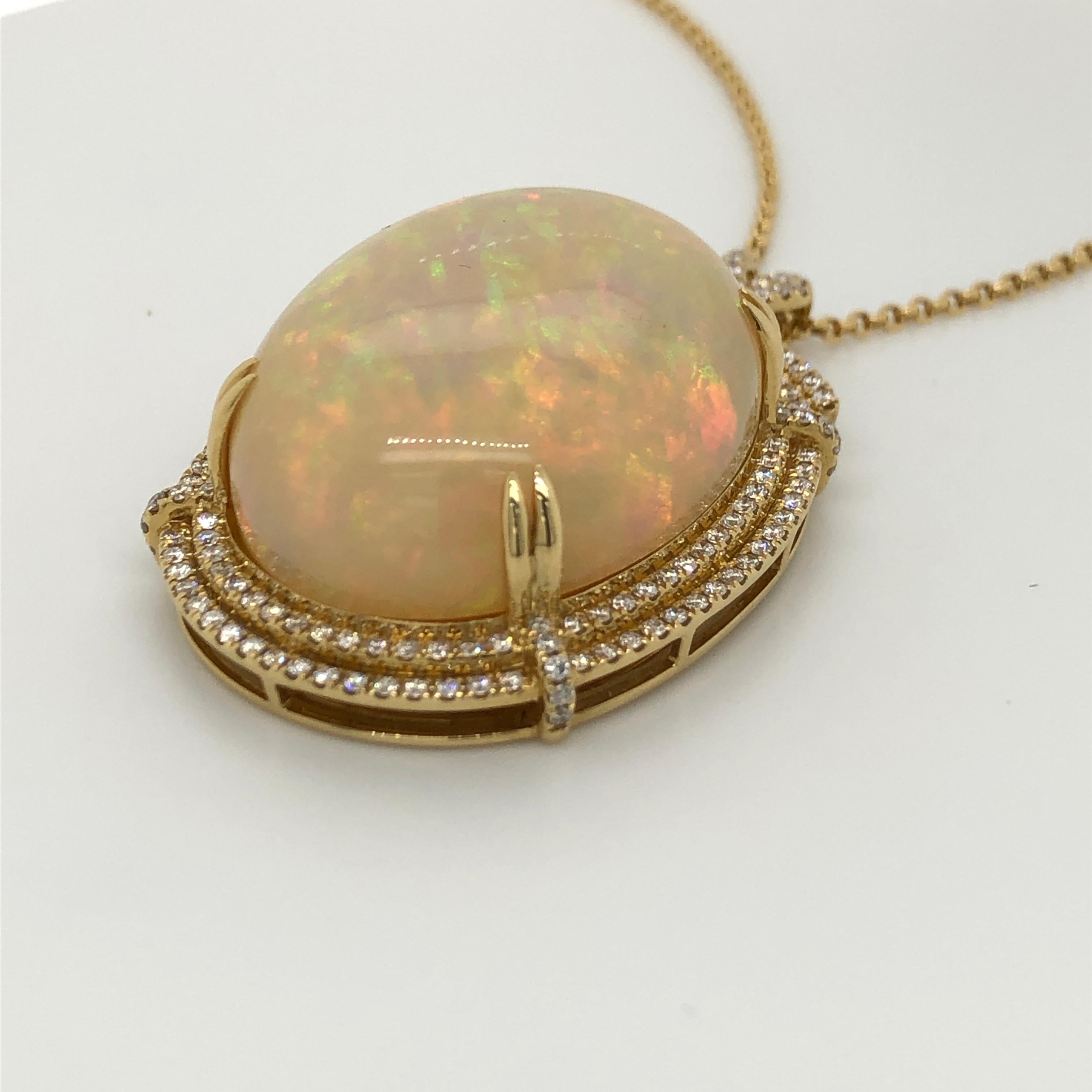 Discover the sweet iridescence of Neopolitan Opal in this gorgeous Le Vian Couture 18K Honey Gold Pendant Necklace. The center stone is over 36 carats in weight, with 1-1/4 cts. t.w. Vanilla Diamonds accents and 1/20 ct. Chocolate Diamond. 
