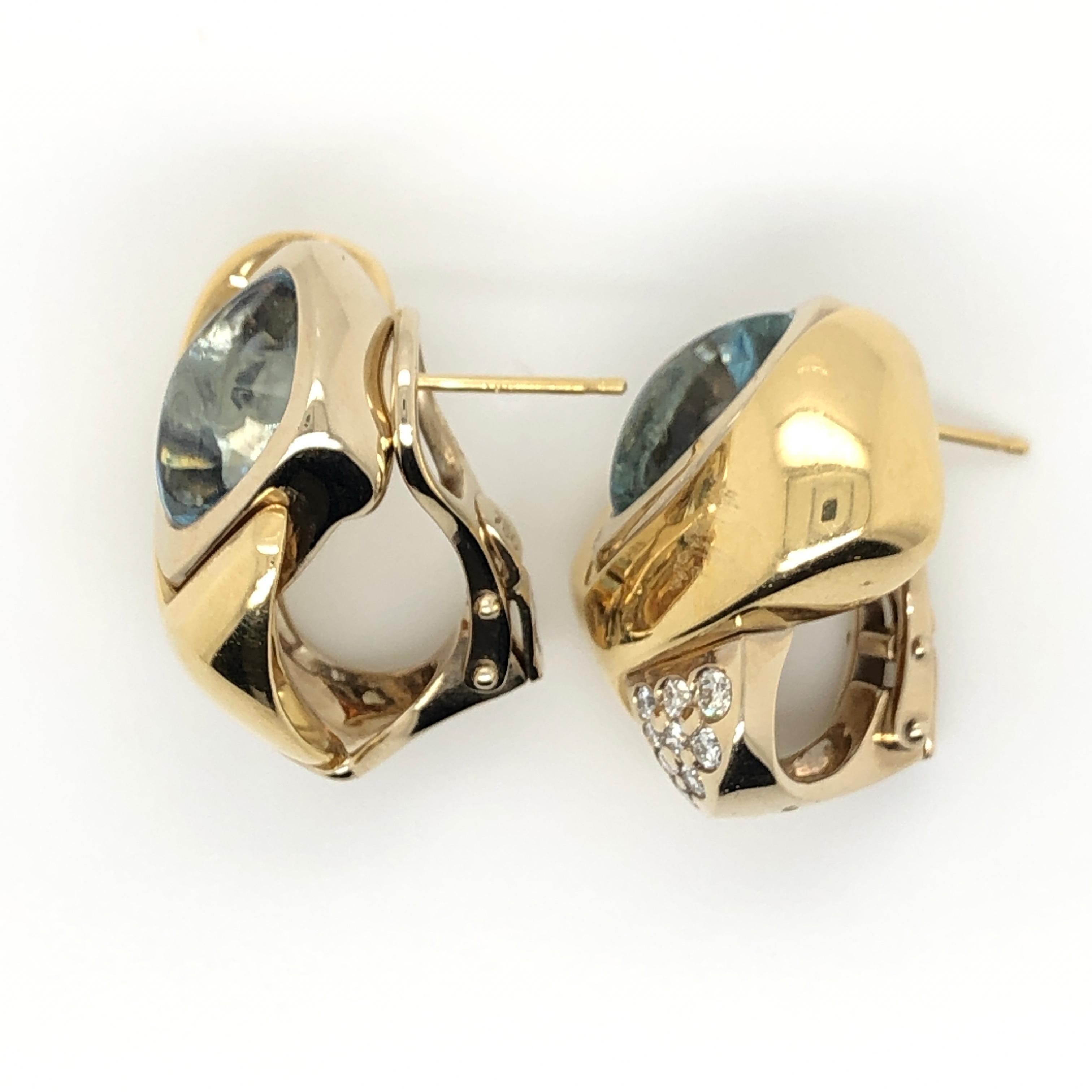 A pair of cabochon cut Aquamarine gems (2-carats each) are the stars in these 18k two tone gold Le Vian Couture earrings accented with 1/3 ct t.w. Vanilla Diamonds.
