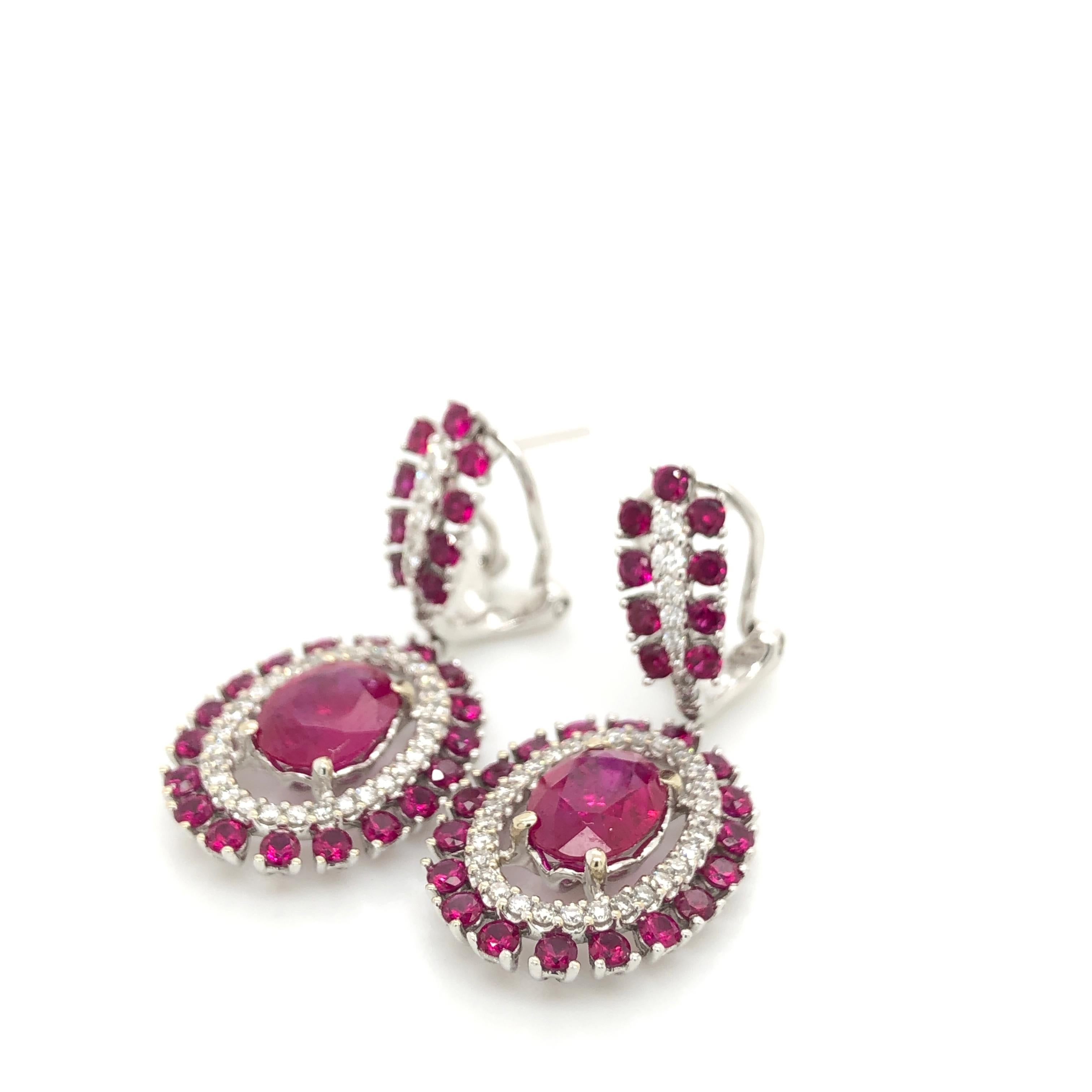 The gem of love and passion is beautifully displayed in these 18K Vanilla Gold Le Vian Couture Earrings featuring  4  1/4 cts. of Passion Ruby (the center rubies approximately 1-1/4 ct each) accented with 1/2 cts. t.w. Vanilla Diamonds.