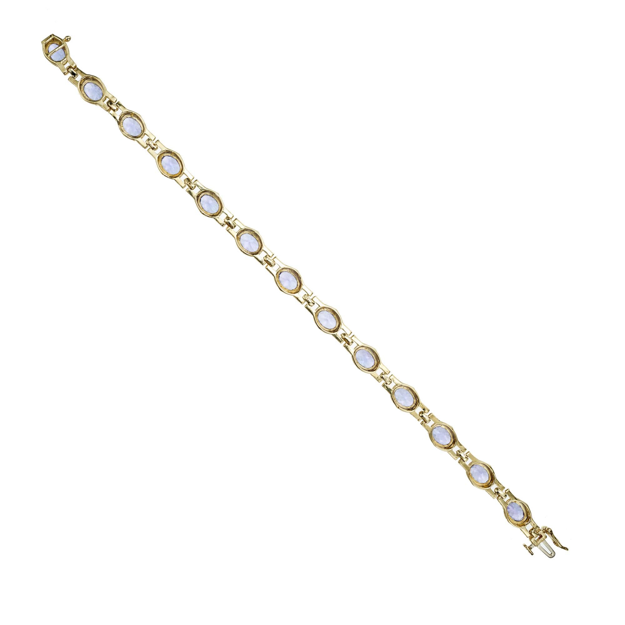 Le Vian tanzanite link bracelet. 13 oval blue tanzanite gemstones, set in a 14k yellow gold prong link bracelet which has a 3 row panther link between the stones. 8 inches long. 
Le Vian is known for its LOVE of reinventing several categories of