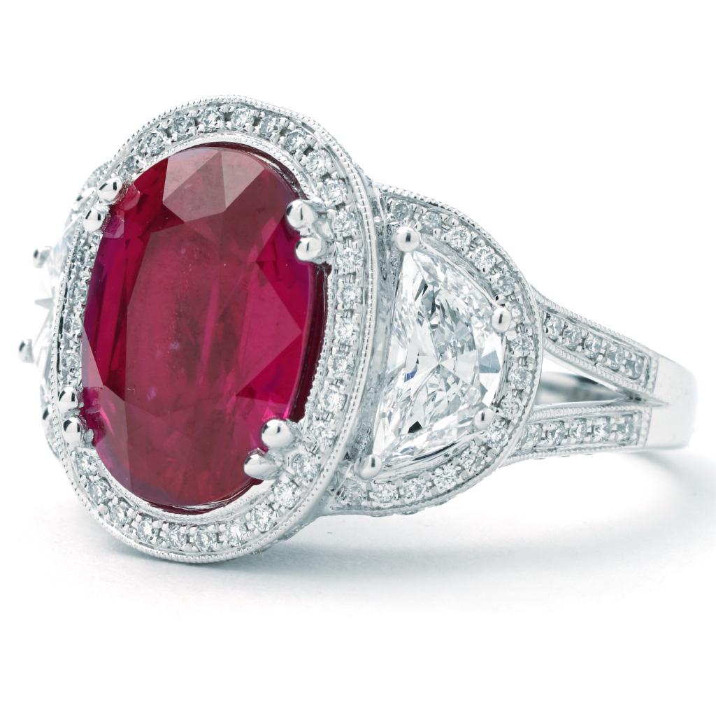 Stunning One of a kind Ring from Le Vian Couture. AGL certificate included. Copy of original Levian certificate included.

This Le Vian ring is made of 18K white gold. It contains an oval ruby weighing 6.40 CTTW. It also has two half/moon G-H color,