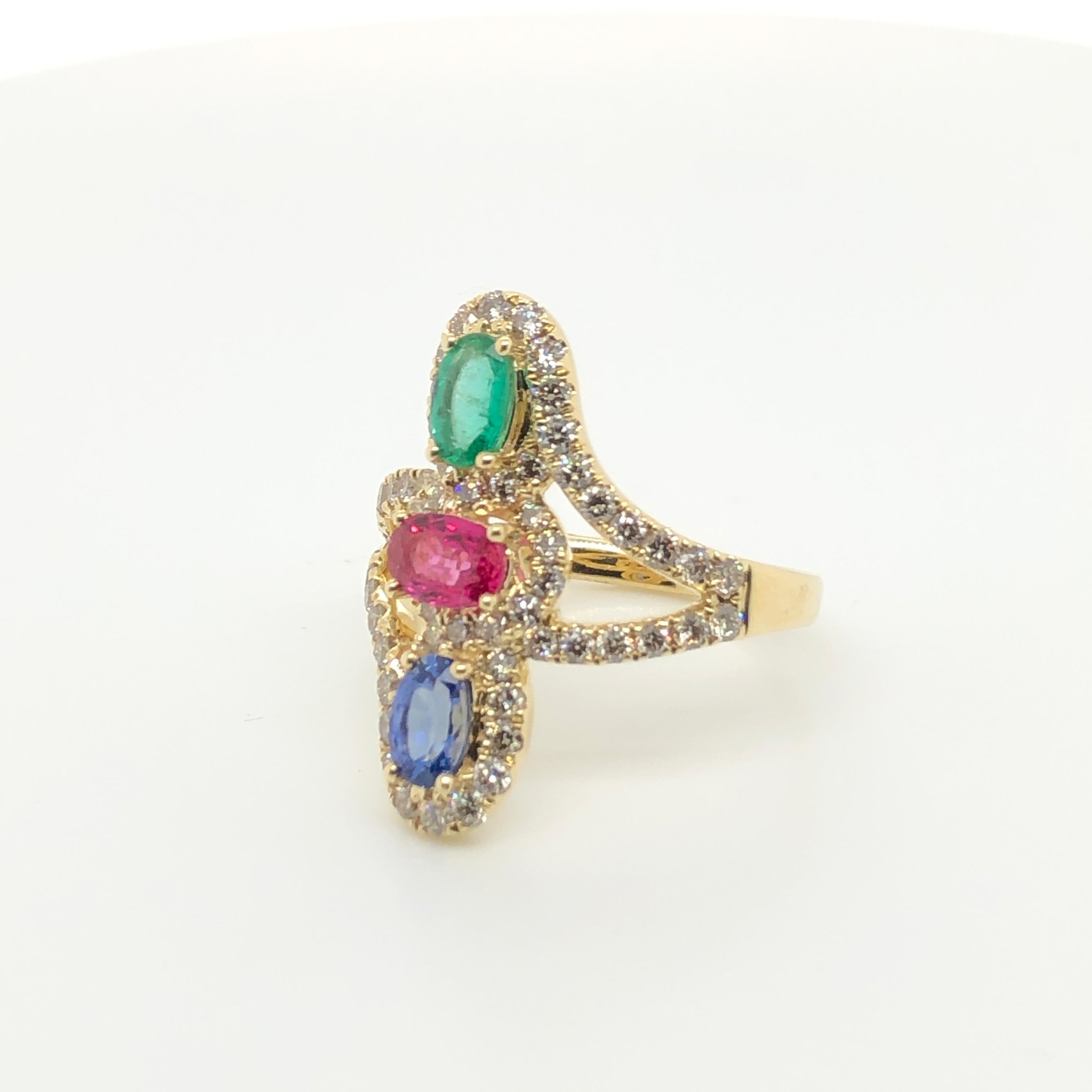 This three-stone ring from Le Vian features a precious combination of oval-cut gems - a 1/2 ct. Ruby,  a 3/8 ct Blue Sapphire and 1/3 ct Emerald - each surrounded with 1 carat of Crème Brulee Diamonds in a 14k yellow gold north/south setting.
Ring
