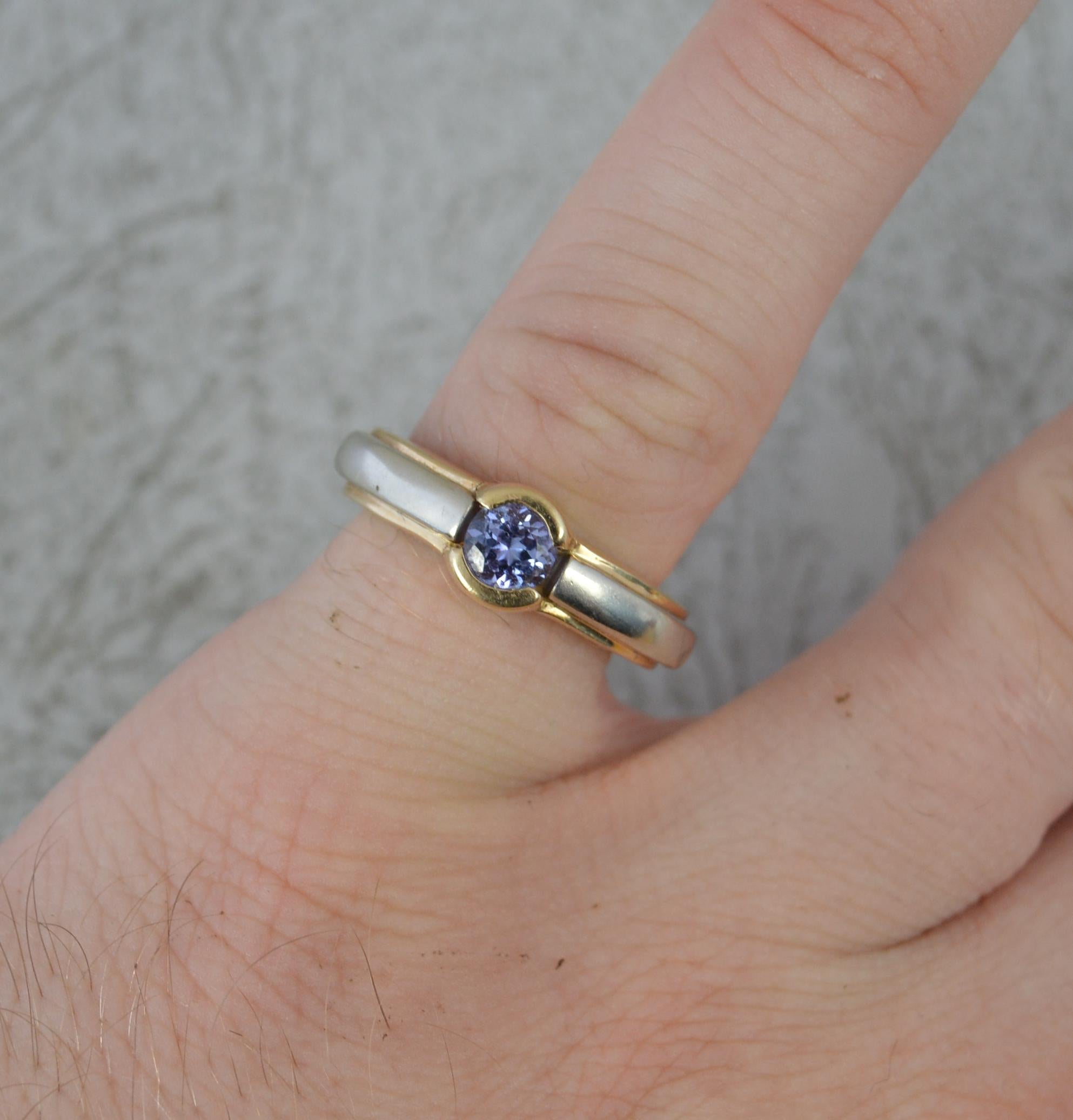 A beautiful tanzanite solitaire ring by Le Vian.
Solid 14 carat yellow gold band with white gold shoulders.
5mm diameter round cut natural tanzanite to centre.
With Le Vian box.

CONDITION ; Very good. Clean and solid band. Well set stone. Light