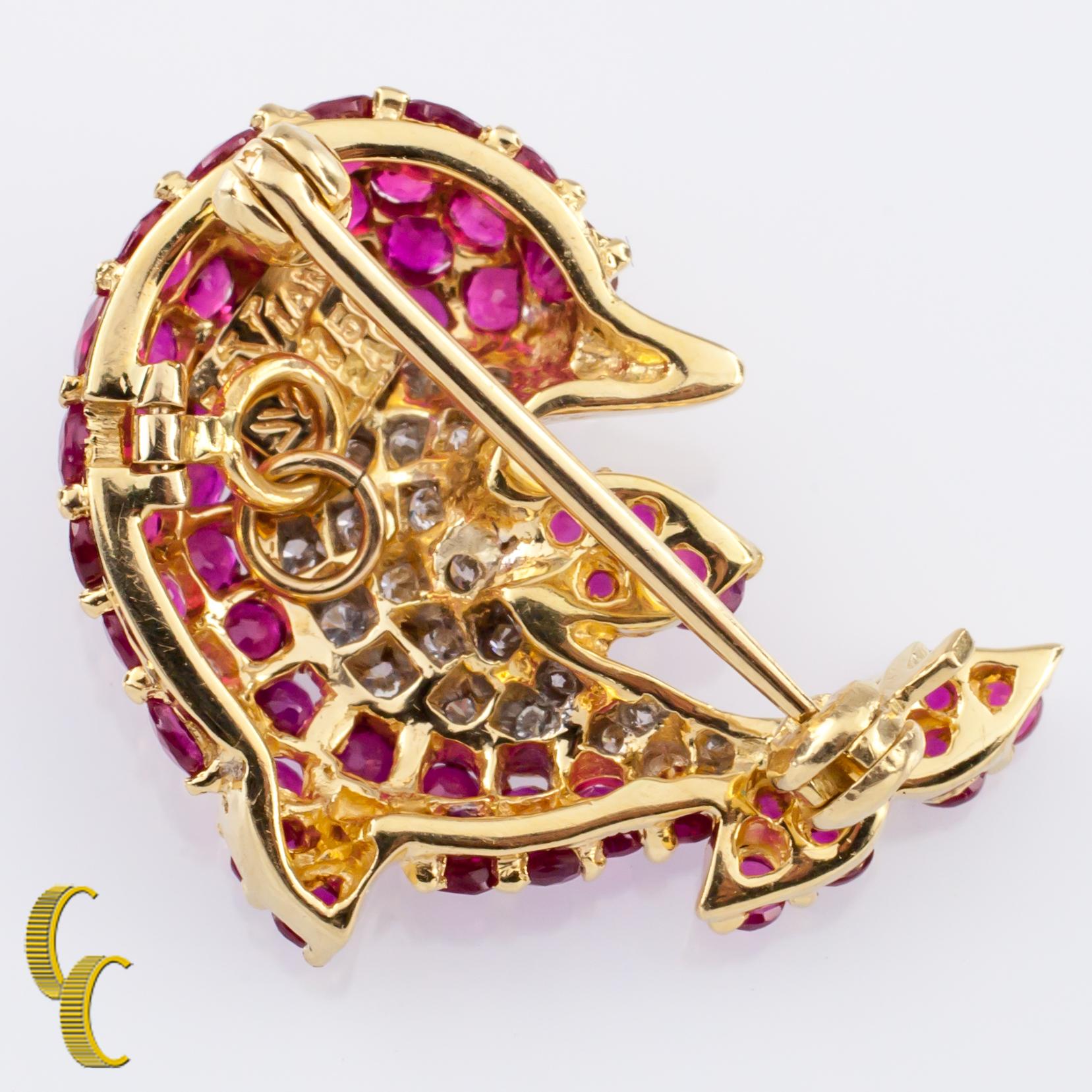 Gorgeous Dolphin Brooch by Le Vian
Includes Pin and Bail to be worn additionally as a pendant
Features Pave Set Rubies and Diamonds with a Green Cabochon stone for the eye
Reverse is hallmarked 