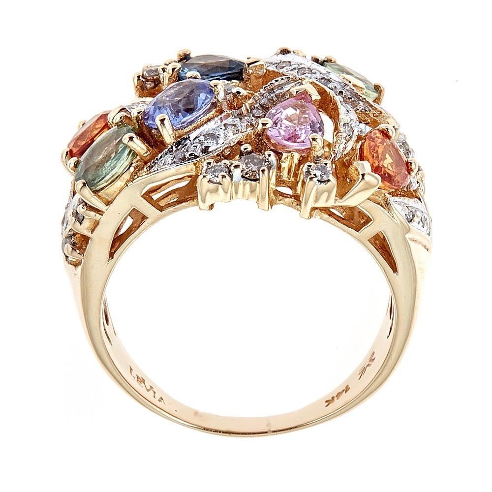Le Vian Multicolored Sapphire and Diamond 14 Karat Yellow Gold Cluster Ring Size 7

Crafted in stunning 14k Yellow Gold, this ring features multicolored oval-shaped sapphires, interlinked by waves of small round diamonds. The perfect addition to