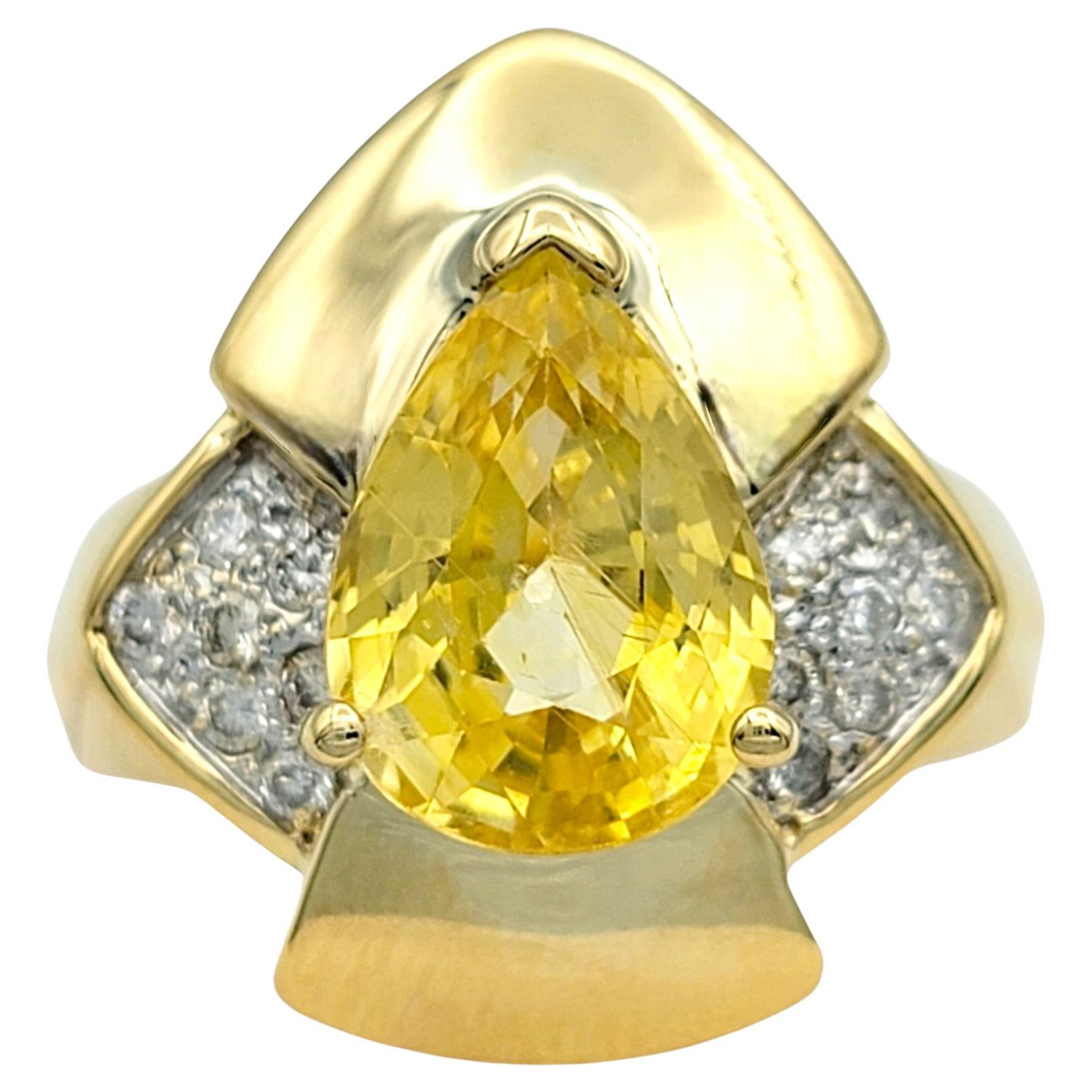 Ring size: 6

This striking Le Vian geometric cocktail ring is a masterpiece of modern luxury, crafted in radiant 18 karat yellow gold. At its heart lies a breathtaking 3.21 carat pear-cut yellow sapphire, glowing with vivid warmth and elegance. The