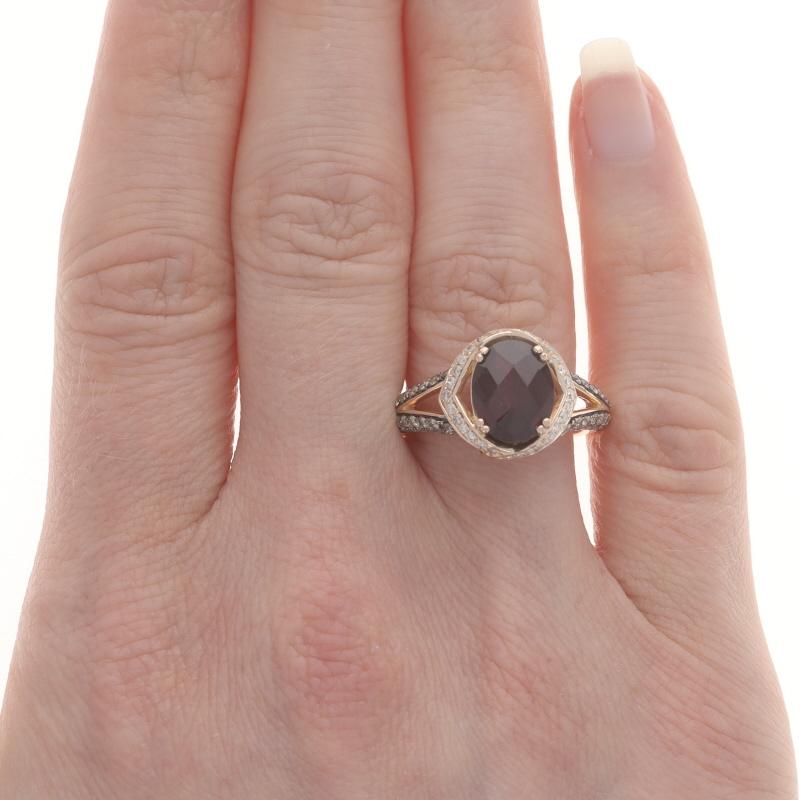 Retail Price: $3140

Size: 7
Sizing Fee: Up 1/2 a size for $50

Brand: Le Vian

Metal Content: 14k Rose Gold

Stone Information

Natural Rhodolite Garnet
Carat(s): 3.00ctw
Cut: Oval Checkerboard
Color: Purplish Red

Natural Diamonds
Carat(s):