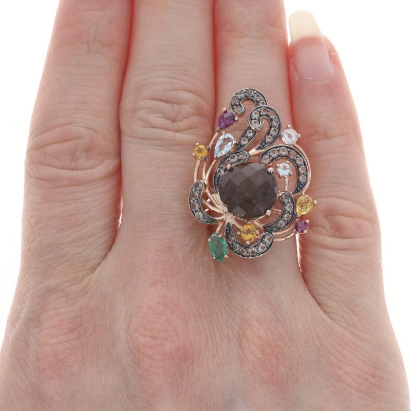 Size: 7
Sizing Fee: Up 1 1/2 sizes for $40 or Down 1 size for $40

Brand: Le Vian

Metal Content: 14k Rose Gold

Stone Information
Natural Smoky Quartz
Cut: Round Checkerboard (solitaire) & Round (accents)
Color: Brown

Natural Citrines
Treatment: